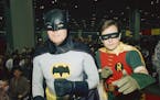 FILE - In this Sunday, Jan. 27, 1989 file photo, actors Adam West, left, and Burt Ward, dressed as their characters Batman and Robin, pose for a photo
