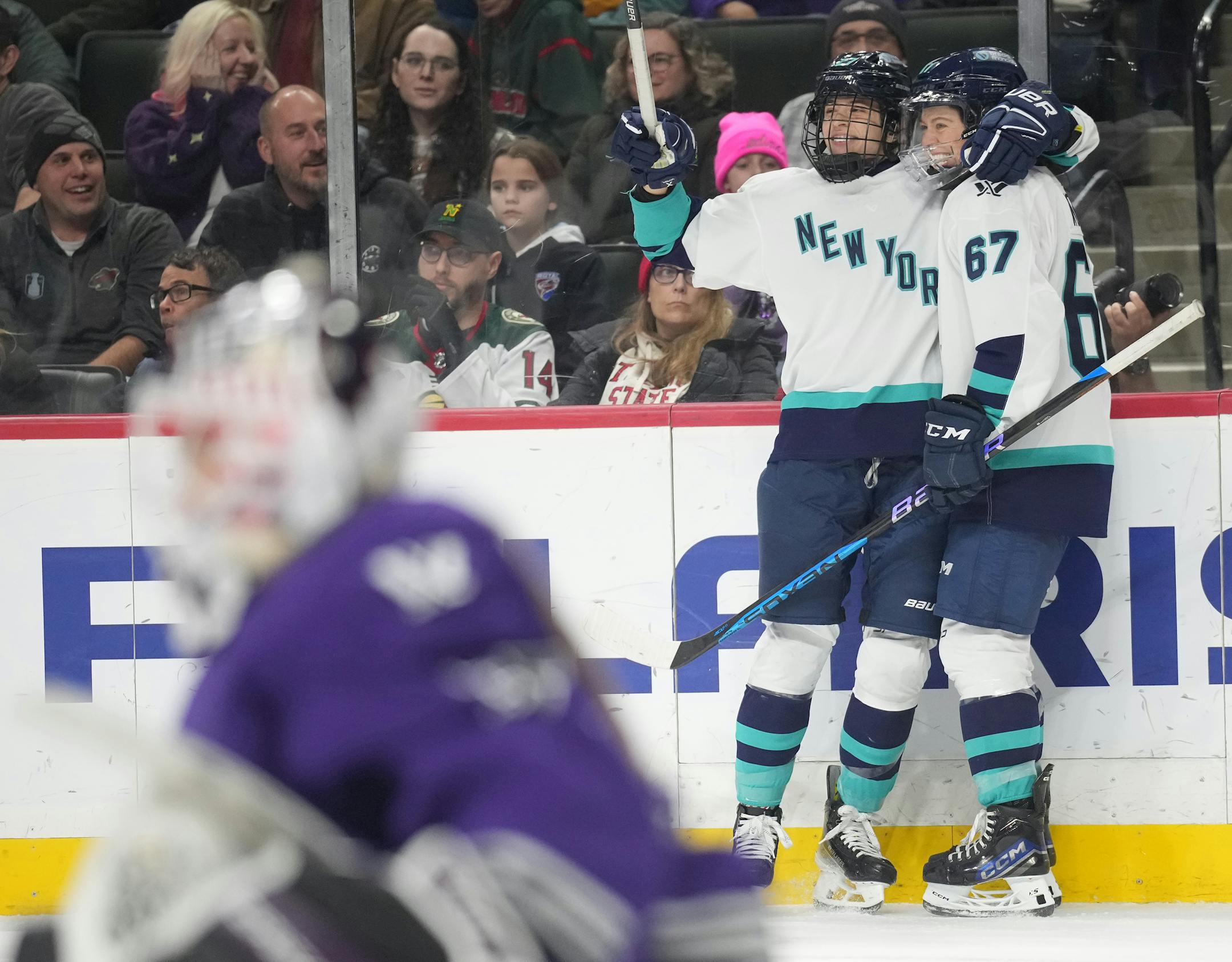 New York player Emma Woods (67) , right celebrates the winning goal in OT at the Xcel Energy Center in St. Paul, Minn., on Sunday, Jan. 14, 2024. PWHL Minnesota vs. New York ] RICHARD TSONG-TAATARII • richard.tsong-taatarii @startribune.com