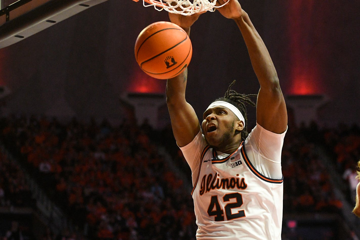 Illinois' Dain Dainja (42) dunks during the first half of an NCAA college basketball game against Rutgers, Saturday, Feb. 11, 2023, in Champaign, Ill. (AP Photo/Michael Allio)