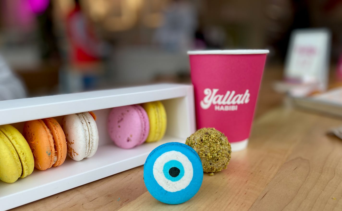 Sweets at Babas include an evil eye decorated macaroon, havla and more. Photo by Joy Summers