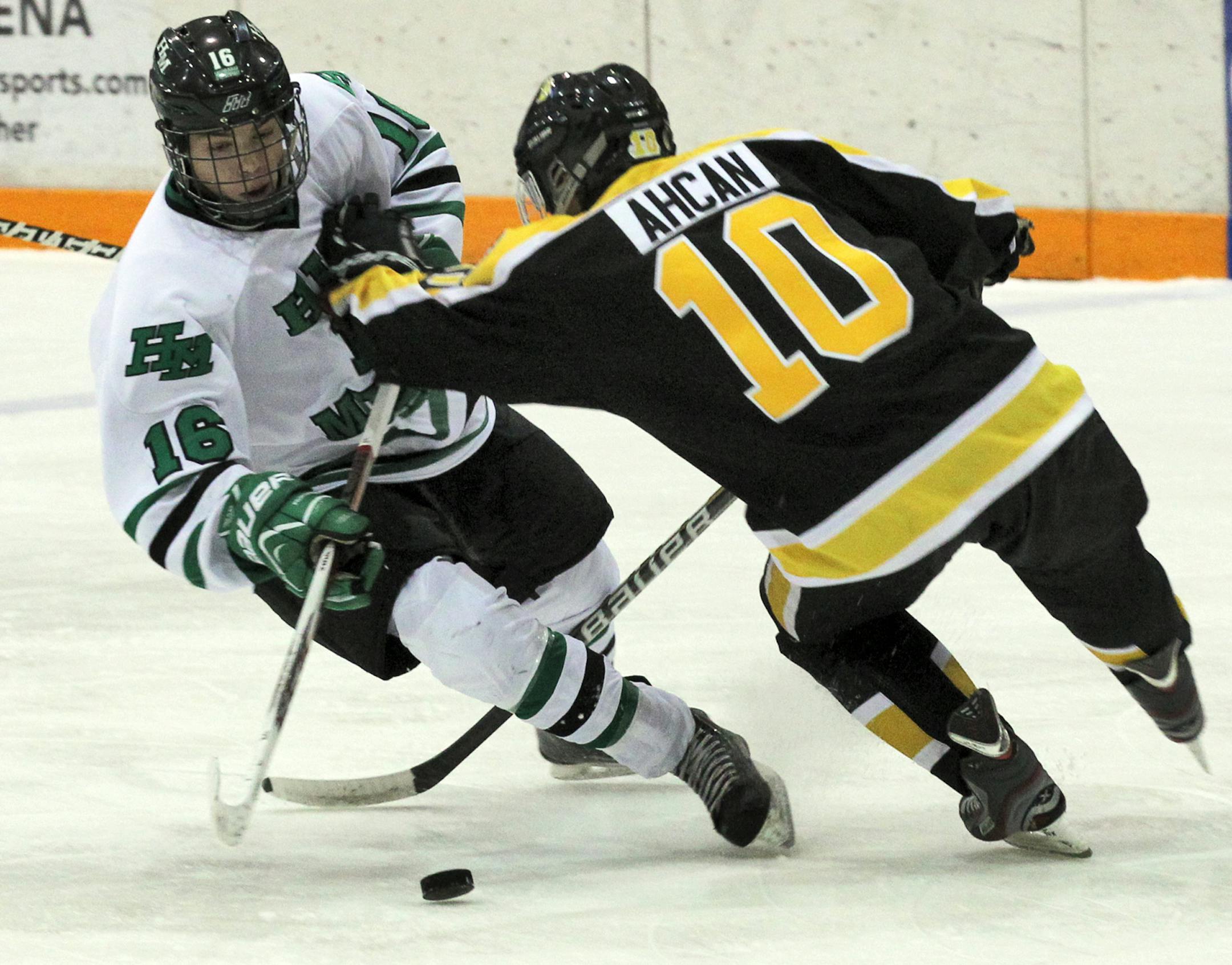Josh French of Hill-Murray and Jack Ahcan of Burnsville fought for control of the puck Thursday in the Schwan Cup hockey tournament.