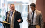 Defendant Abdimajid Mohamed Nur, right, walks into United States District Court with his attorney Edward Sapone on Monday, April 22 in the first Feedi