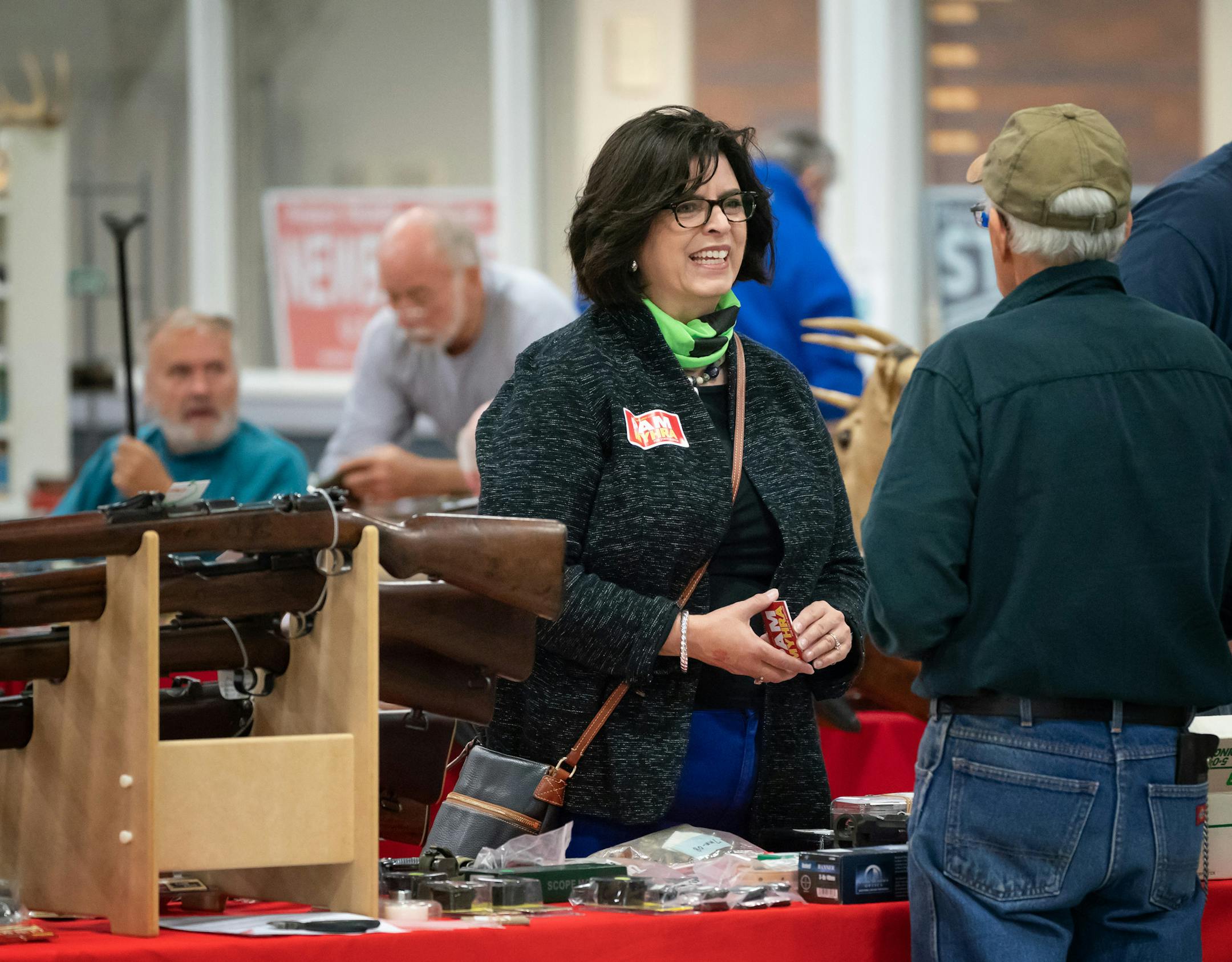GOP State Auditor candidate Pam Myhra talked with voters at a gun show in Eveleth, Minn., Saturday, October 6, 2018.