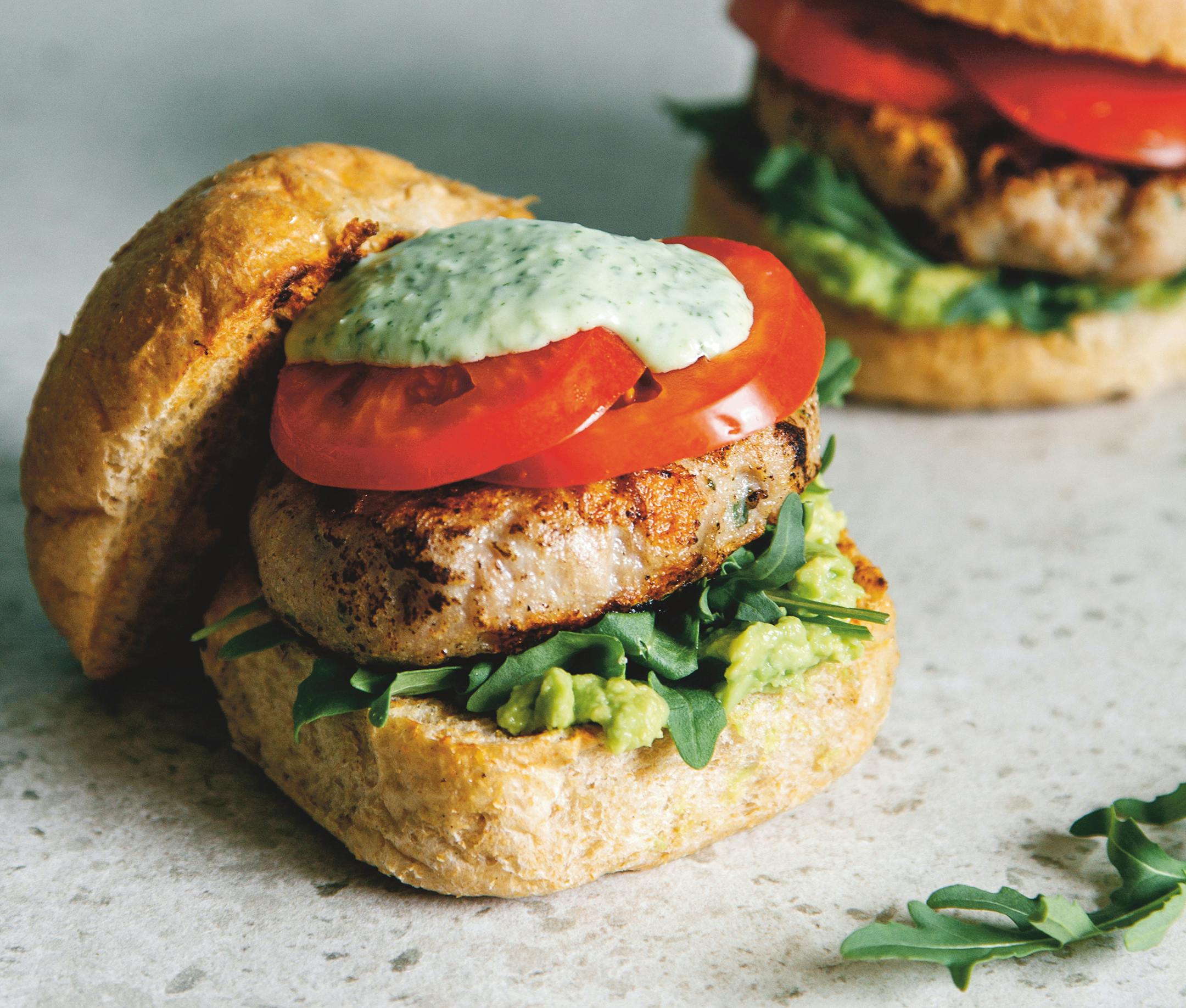 Grilled Chicken Burgers with Basil Aioli From "The BBQ Companion" by Oscar Smith (Smith Street, 2023; $24.95). Photo: Billy Law