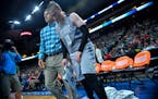 Minnesota Lynx guard Lindsay Whalen (13) was escorted to the locker room after injuring her left hand in the third quarter against the Atlanta Dream o