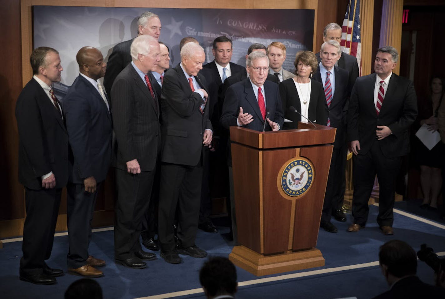 Senate Majority Leader Mitch McConnell (R-Ky.) speaks alongside fellow Republicans after the passage of their tax bill, on Capitol Hill in Washington, in the early a.m. hours of Dec. 2, 2017. By a 51-49 vote, the Senate passed the most sweeping tax rewrite in decades; McConnell waved off any deficit concerns. &#xec;I&#xed;m totally confident this is a revenue-neutral bill," he said. (Tom Brenner/The New York Times) ORG XMIT: MIN2017120414192923