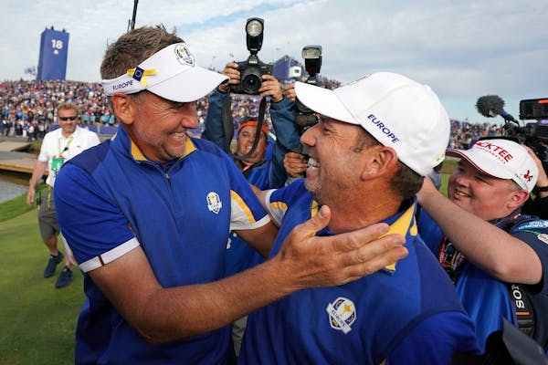 FILE - In this Sept. 30, 2018, file photo, Europe's Sergio Garcia, right, celebrates with Ian Poulter after Europe won the Ryder Cup on the final day 