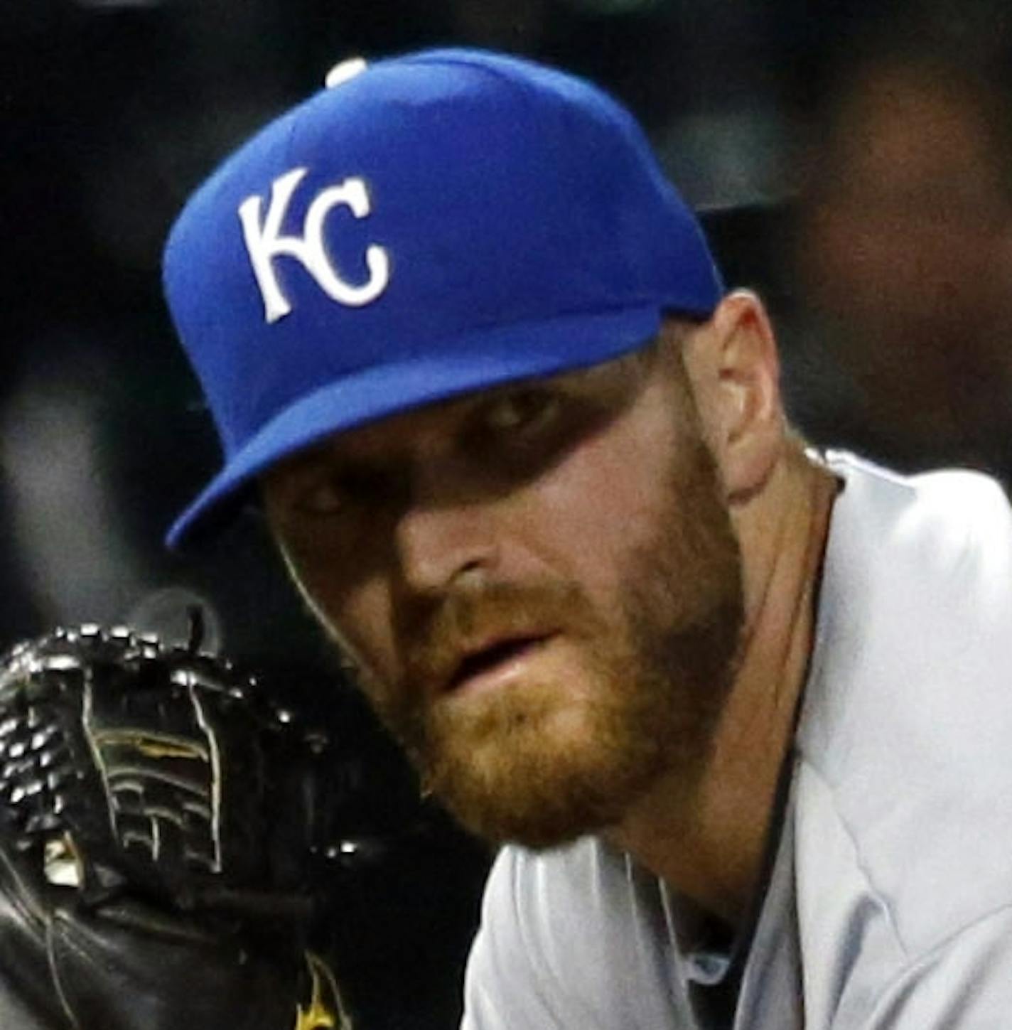 Kansas City Royals relief pitcher Wade Davis checks the runner at first during the eighth inning of a baseball game against the Chicago White Sox on Tuesday, July 22, 2014, in Chicago. (AP Photo/Stacy Thacker) ORG XMIT: ILST108