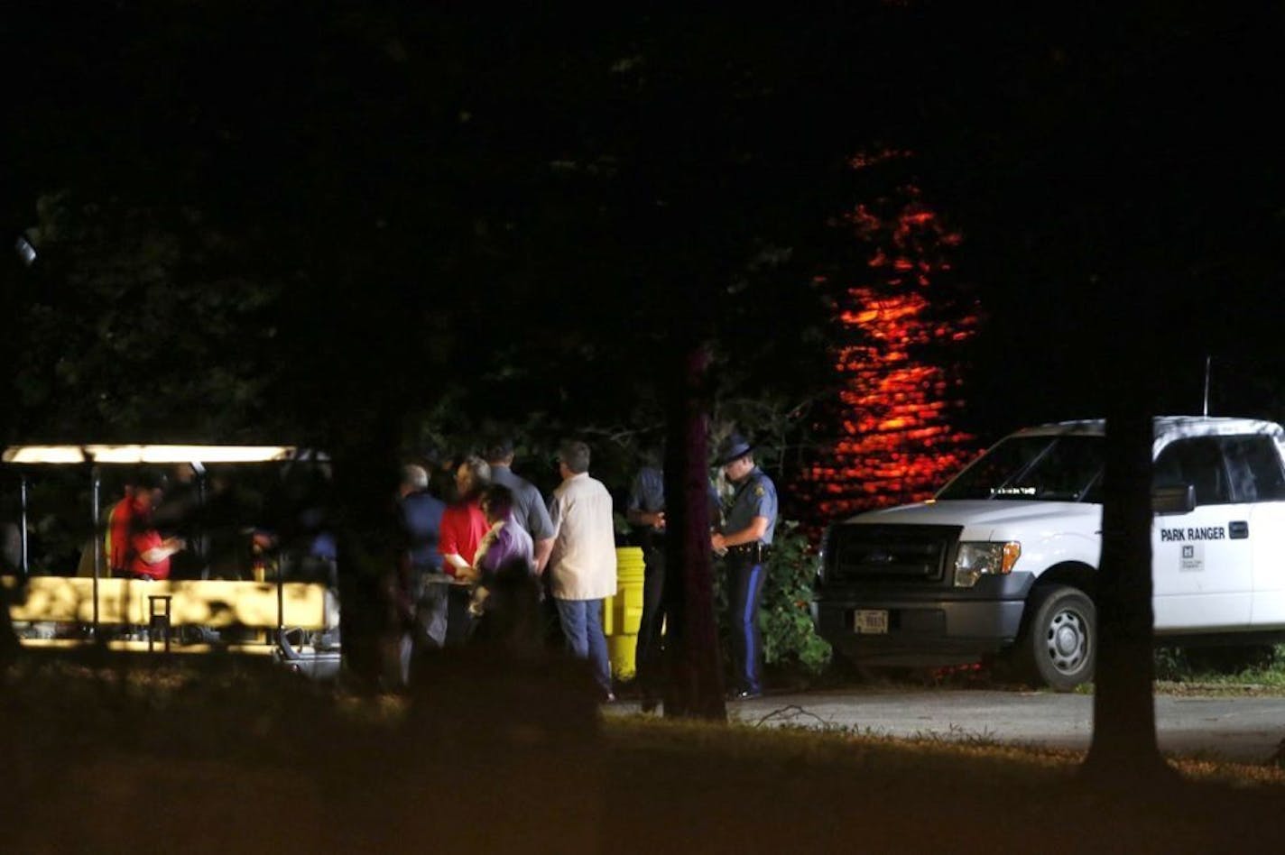 Rescue crews work at the scene of a deadly boat accident at Table Rock Lake in Branson, Mo., Thursday, July 19, 2018. A sheriff in Missouri said a tourist boat has apparently capsized on the lake, leaving several people dead and several others hospitalized.