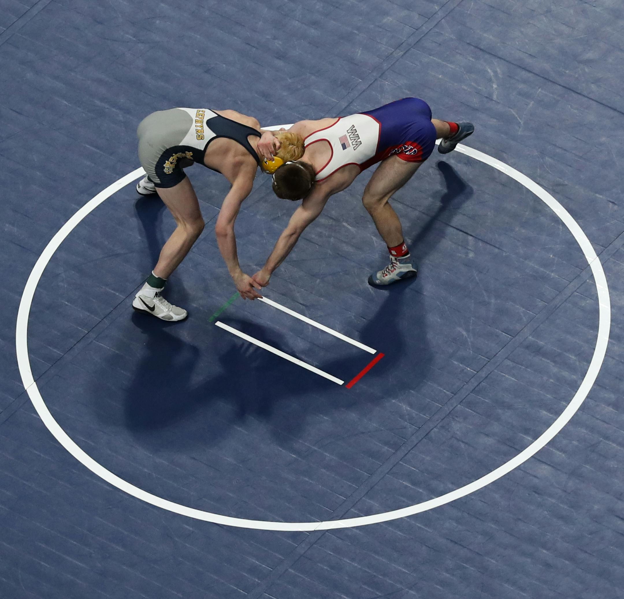Bryce FitzPatrick of Mahtomedi (left) battled Carter Entinger of Watertown-Mayer Lutheran in the class 2A 138 lb. bout. ] Shari L. Gross • shari.gross@startribune.com The Class 3A, 2A and 1A wrestling state meet individual championships were held Saturday, March 2, 2019 at the Xcel Energy Center in St. Paul. Minn.