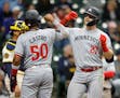 Ryan Jeffers, right, was greeted by teammate Willi Castro after hitting a three-run home run in the seventh inning Wednesday in Milwaukee.