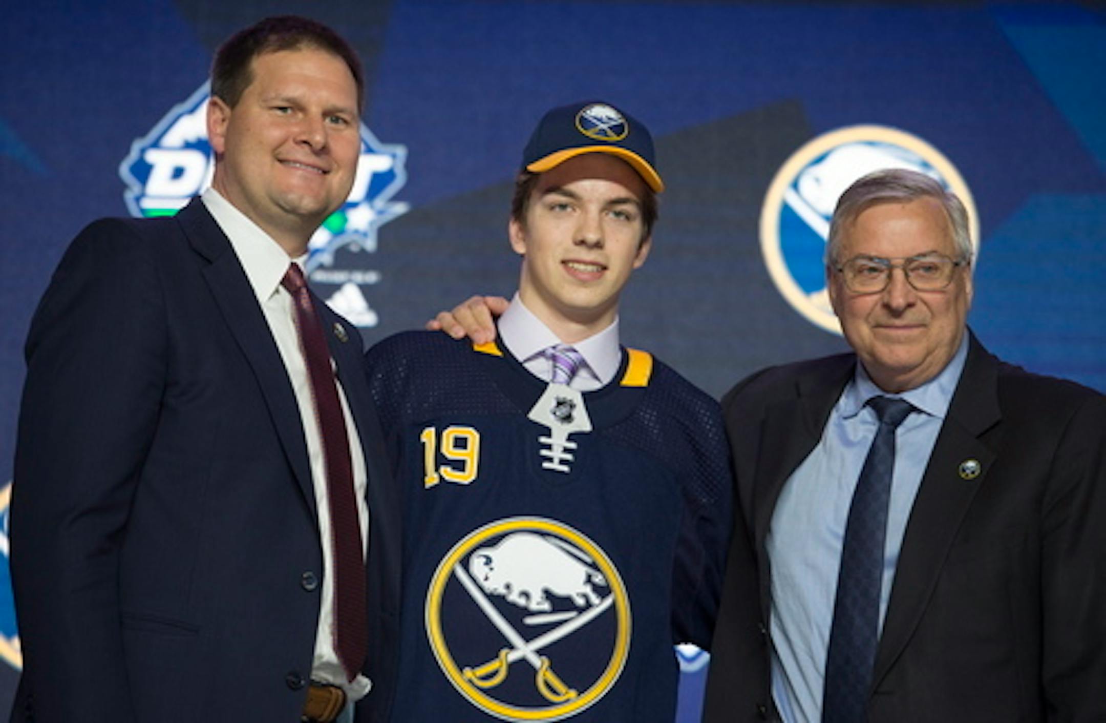 Ryan Johnson wears a Buffalo Sabres jersey during the first round of the NHL hockey draft Friday, June 21, 2019, in Vancouver, British Columbia. (Jonathan Hayward/The Canadian Press via AP)