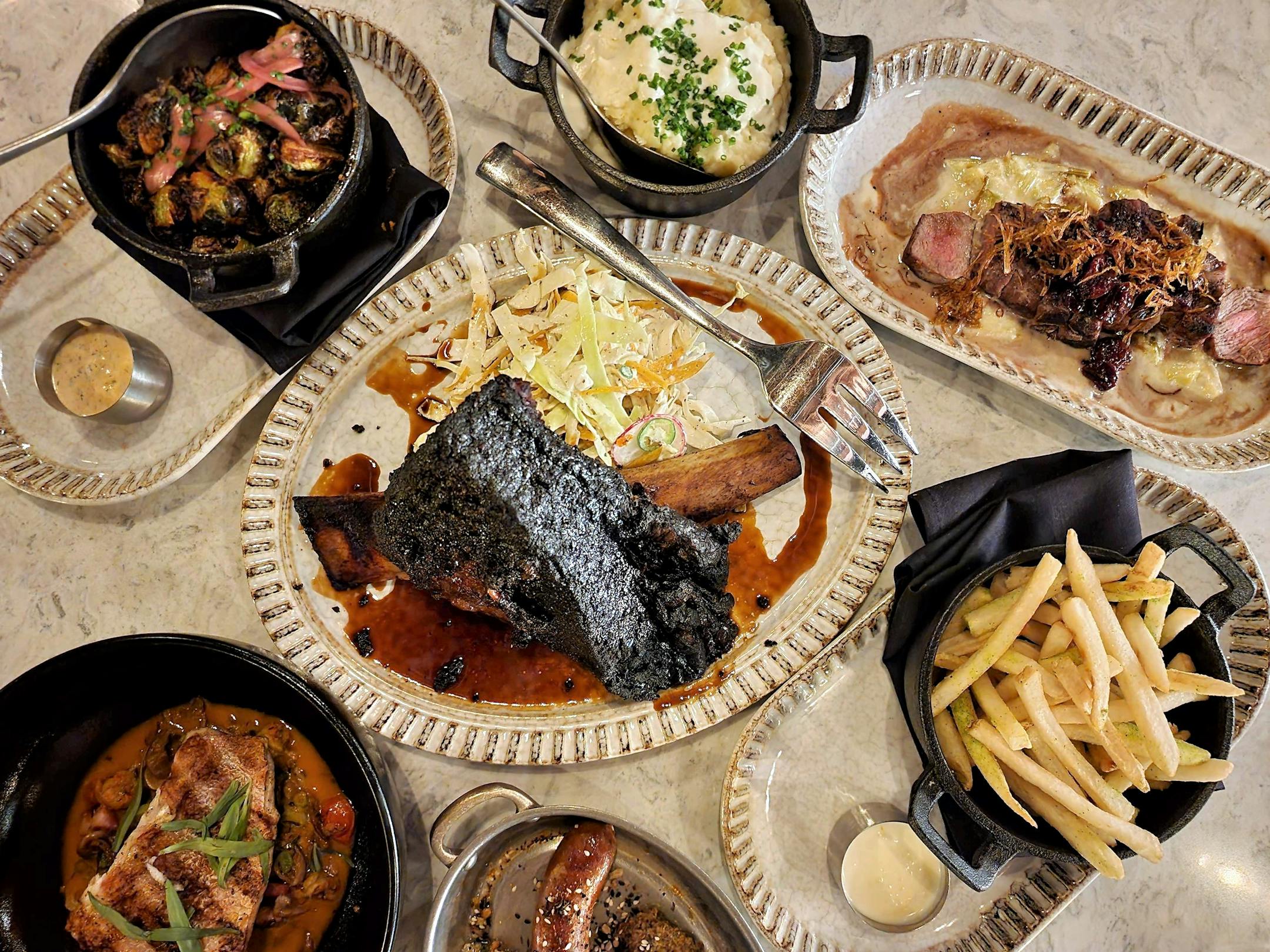 The meat-heavy menu has a few favorites from the original restaurant, including the beef long rib.