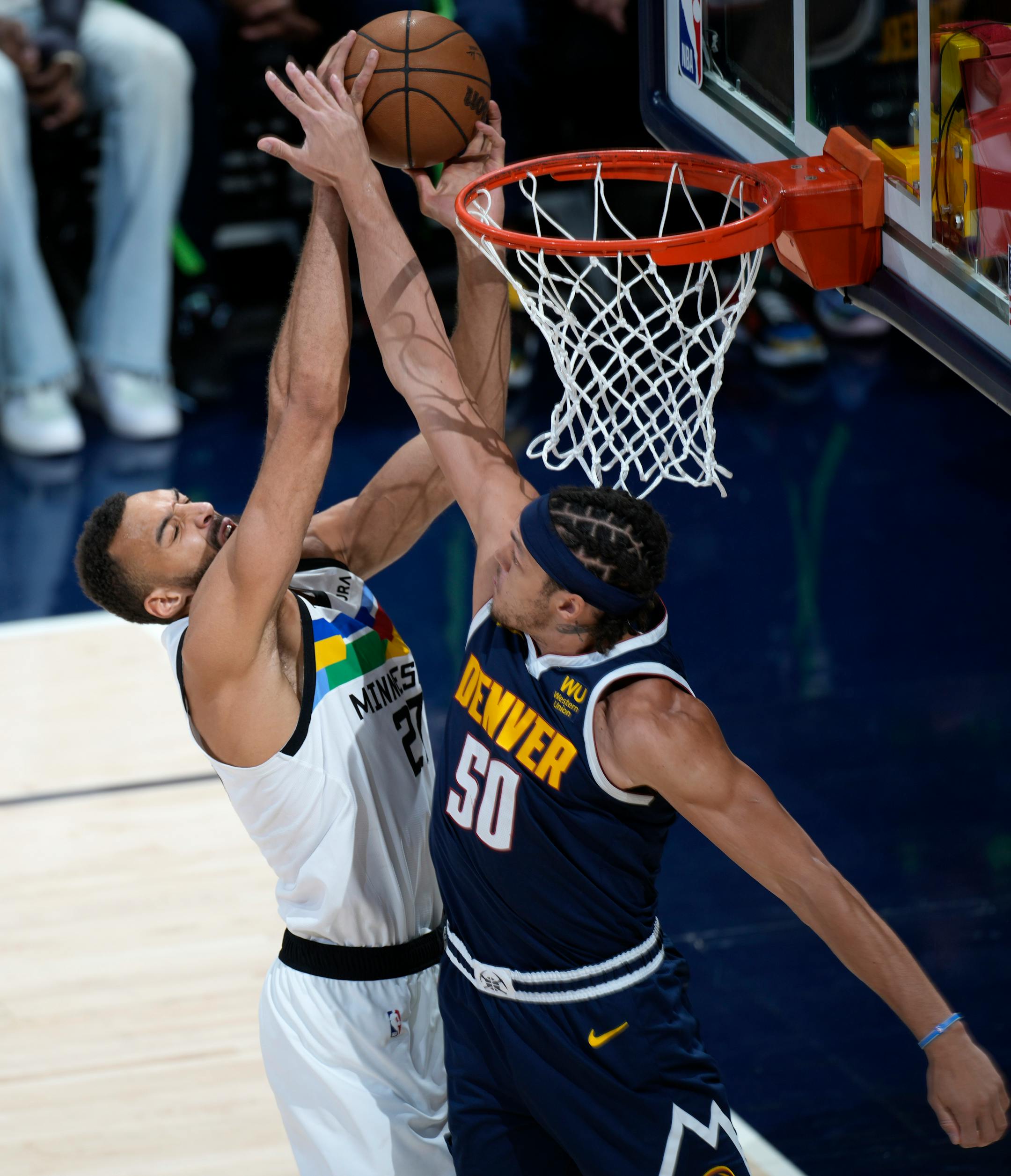 Denver Nuggets forward Aaron Gordon, right, fouls Minnesota Timberwolves center Rudy Gobert in the first half of Game 2.
