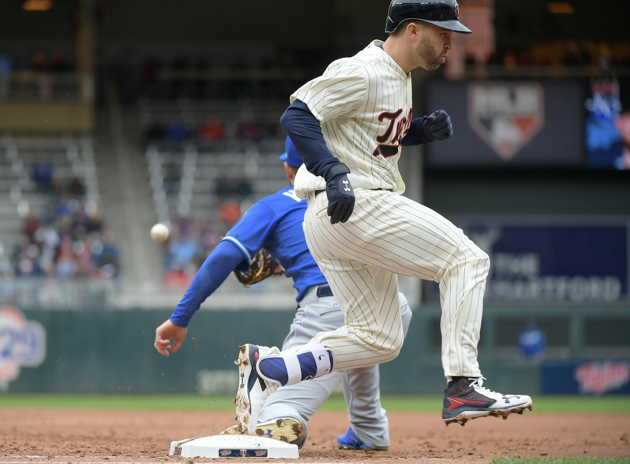 Minnesota Twins second baseman Brian Dozier (2) was safe at first after hitting an RBI single in the bottom of the second inning, bringing home shortstop Eduardo Escobar.