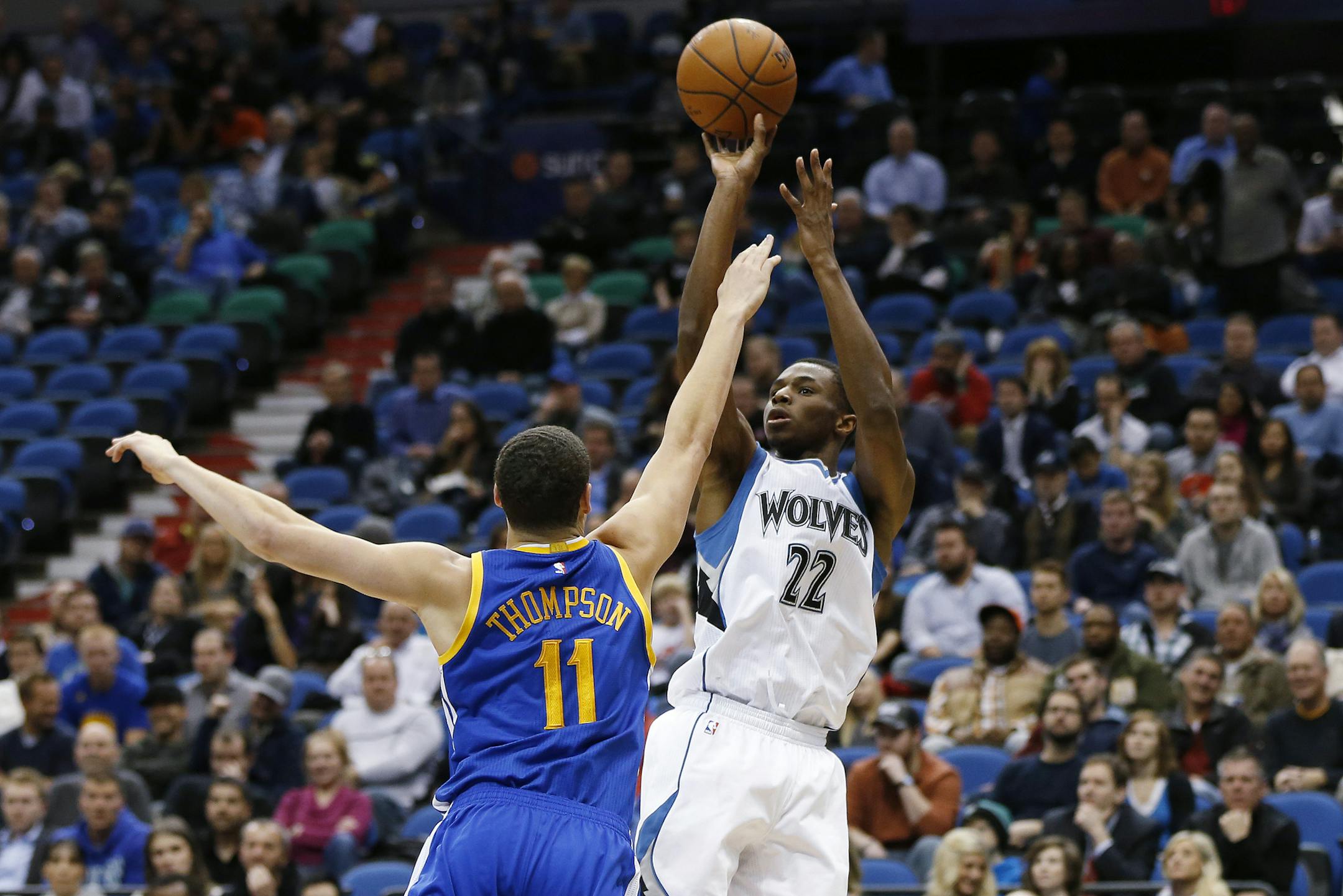 Wolves forward Andrew Wiggins took a shot against Warriors guard Klay Thompson during the first half Monday.