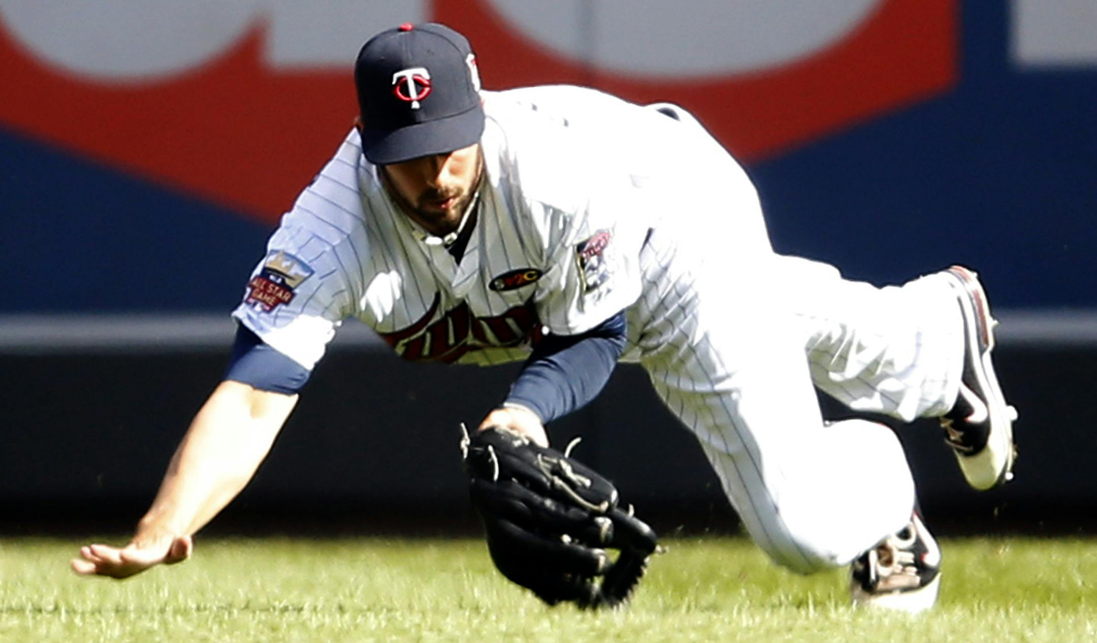Twins right fielder Chris Colabello (20) made diving catch on a ball hit by Eric Sogard in the second inning. ] CARLOS GONZALEZ cgonzalez@startribune.com - April 7, 2014, Minneapolis, Minn., Target Field, MLB, Minnesota Twins vs. Oakland A‚Äôs ‚Äì Twins home opener