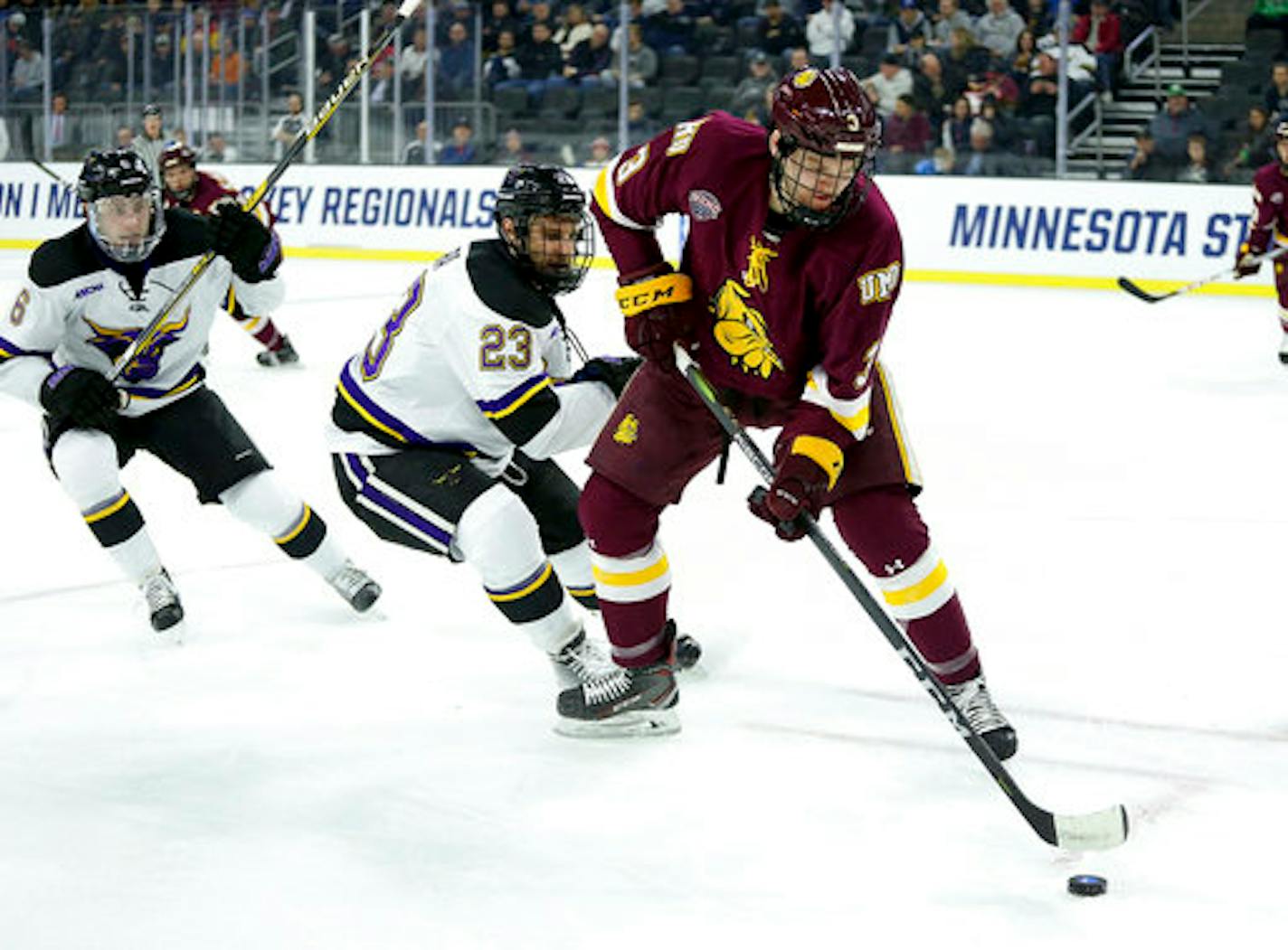 Minnesota Duluth's Mikey Anderson (3) controls the puck in front of Mankato's Nicholas Rivera (23) during the first period of an NCAA regional men's college hockey tournament game, Friday, March 23, 2018, in Sioux Falls, S.D. (AP Photo/Dave Eggen)