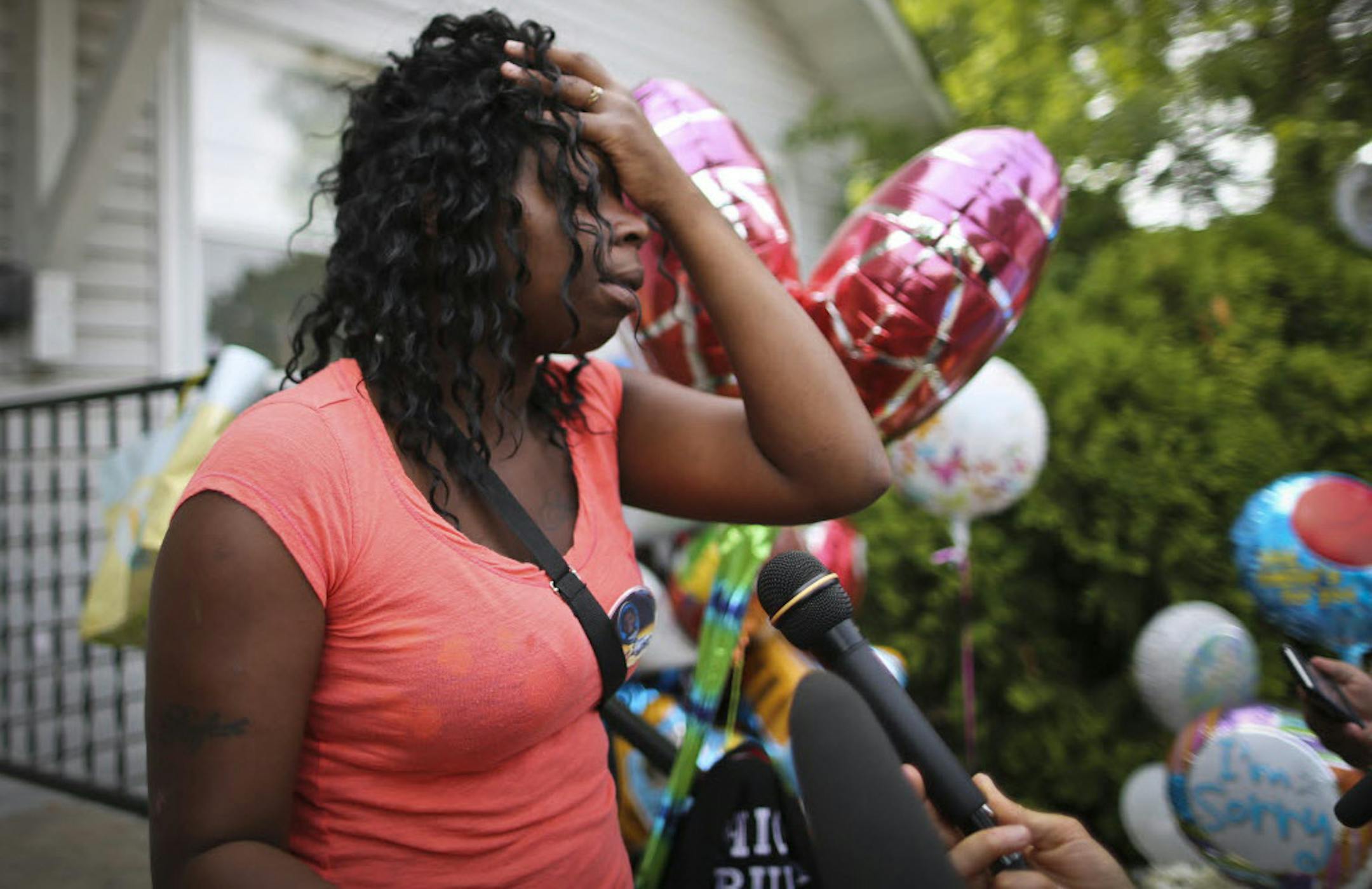 Christina Banks, outside the home Friday where 5-year-old son Nizzel George was shot to death Tuesday: "It hurts so bad," she said.