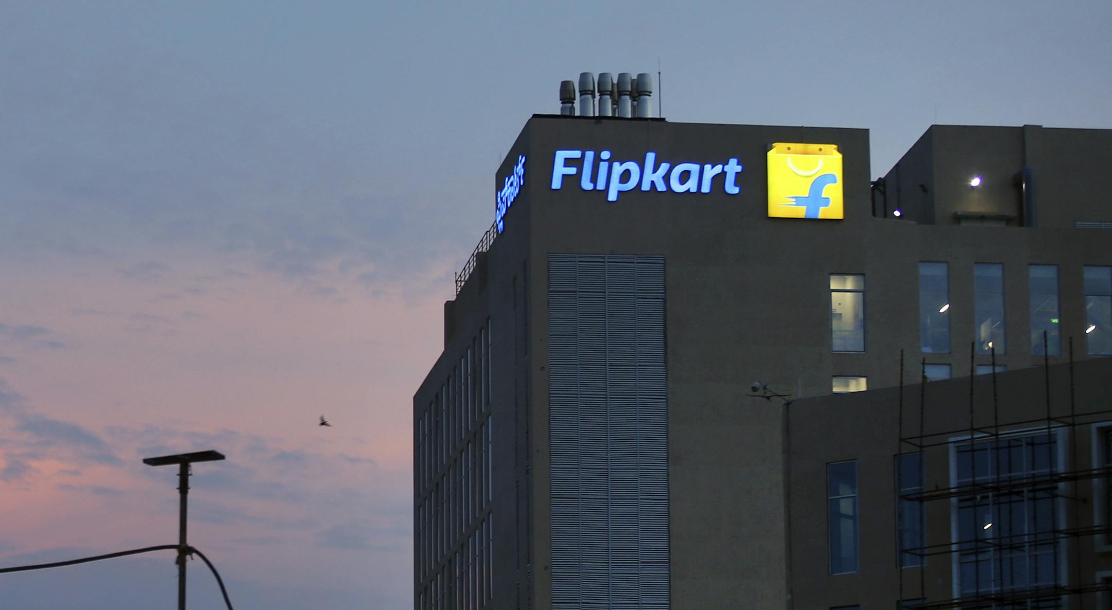 The lit company logo is seen at India's giant online retailer Flipkart's headquarters in Bangalore, India, Wednesday, May 9, 2018. Walmart is paying $16 billion for a controlling stake in Flipkart, breaking into a fast-growing economy where it has struggled to establish a foothold. (AP Photo/Aijaz Rahi)