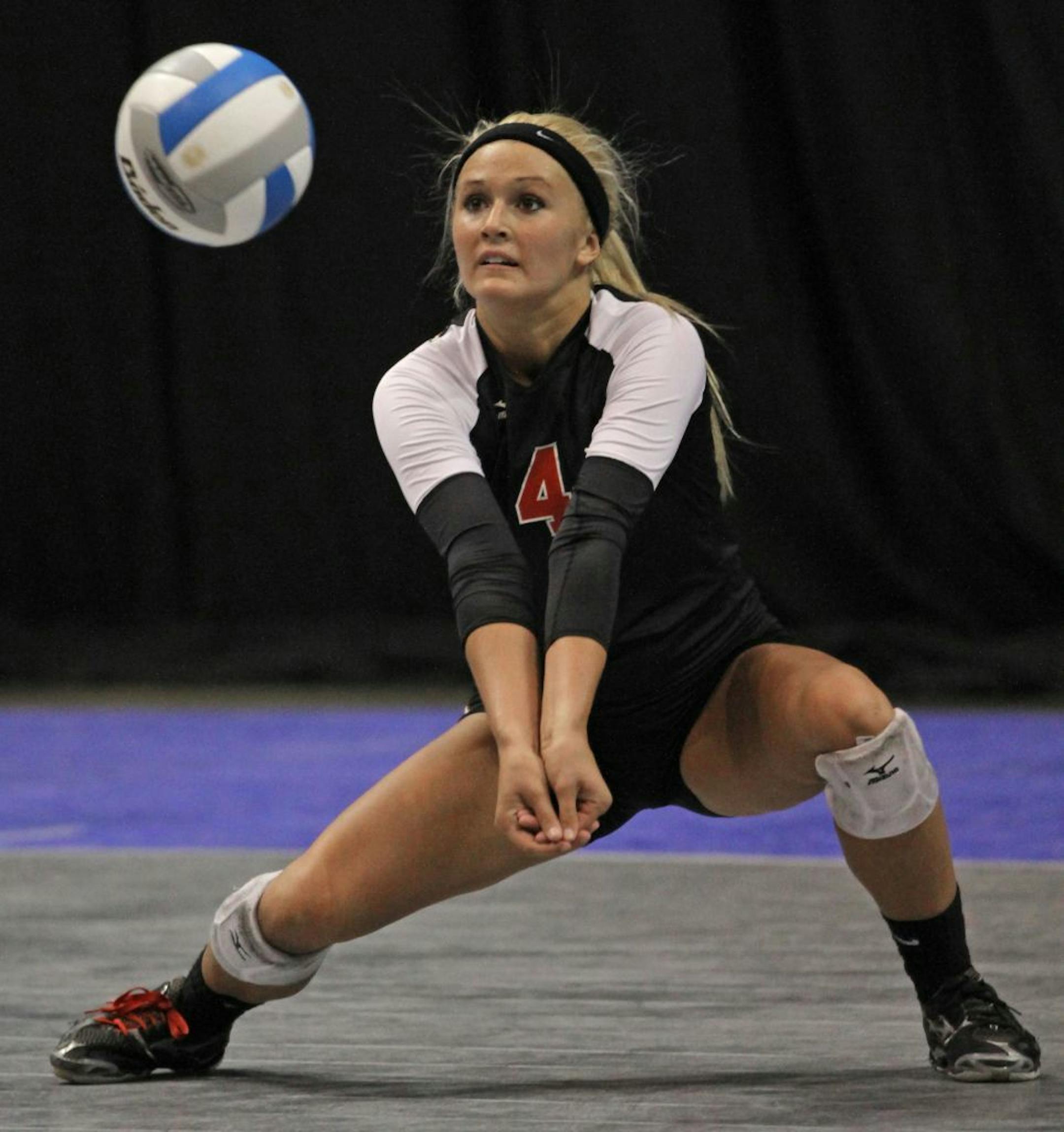 Lakeville North's Alyssa Goehner dug out an Eden Prairie serve during the Class 3A championship game on 11/12/11.