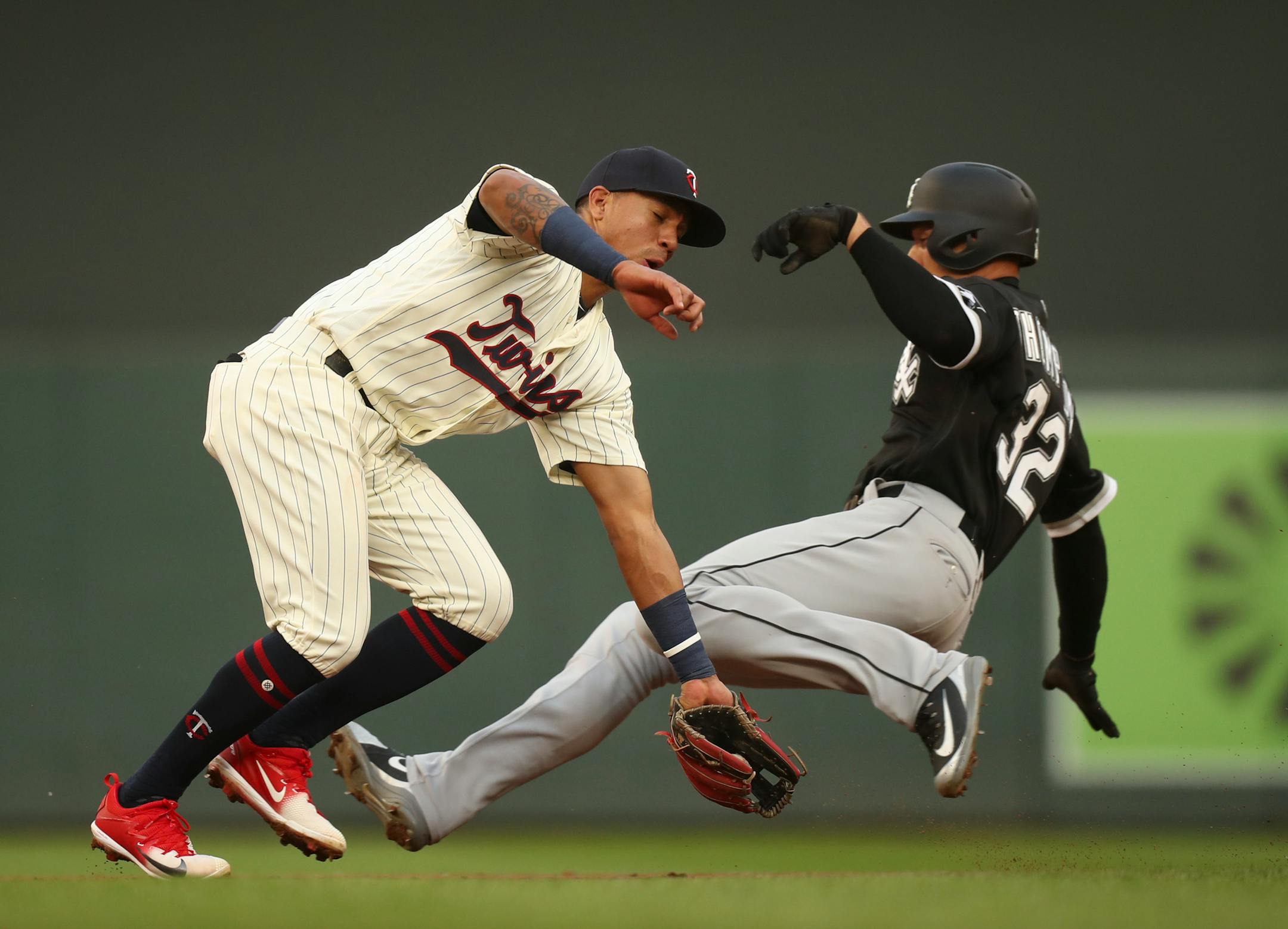 The Chicago White Sox's Trayce Thompson successfully steals second base in the third inning when the throw from catcher Mitch Garver to Twins shortstop Ehire Adrianza was off the mark