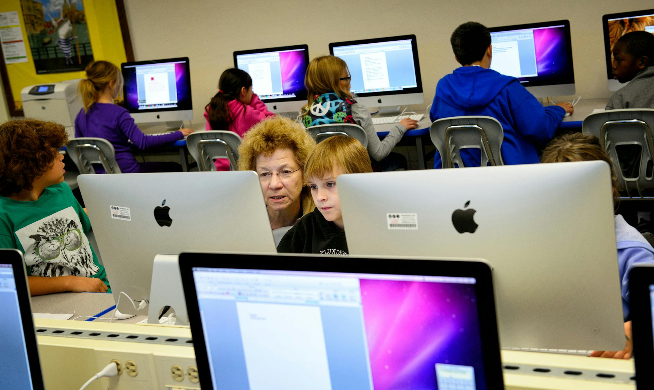 The newly renovated Howe Public School received 35 new iMac computers in the media room where Coreen Blau teaches students, Minneapolis. Monday, September 16, 2013 ] GLEN STUBBE * gstubbe@startribune.com