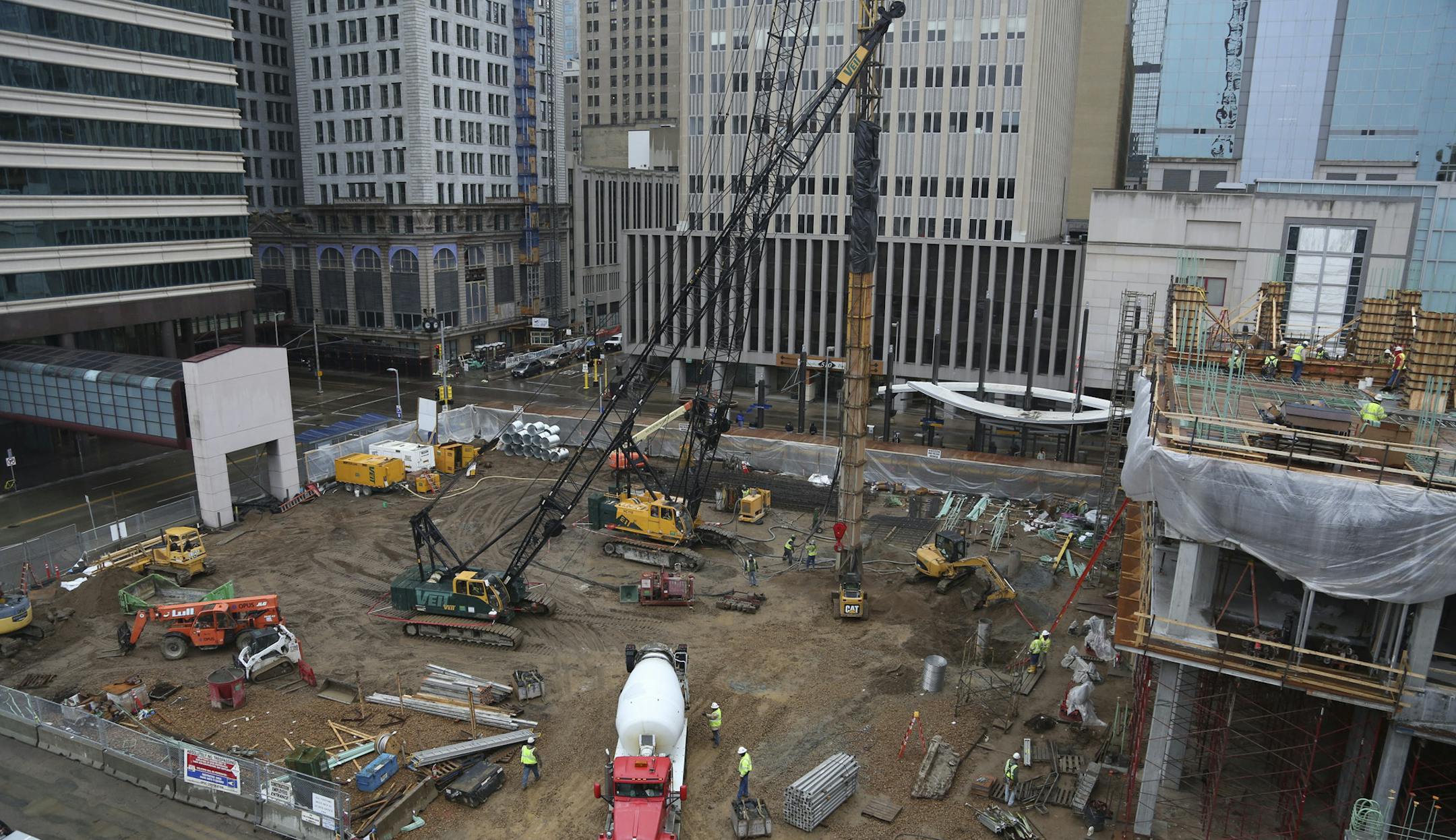 Construction workers make the foundations of the first floors on The Nic, a $100 million 26-story luxury apartment tower at the corner of Fifth St. S. and Nicollet in Minneapolis, Min., Wednesday, May 1, 2013. ] (KYNDELL HARKNESS/STAR TRIBUNE) kyndell.harkness@startribune.com ORG XMIT: MIN1305011707293088