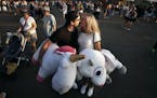 Taylor Greathouse, kissed her boyfriend Daniel Sloper in the midway after wining some stuff animals at the Minnesota State Fairgrounds Sunday August 2