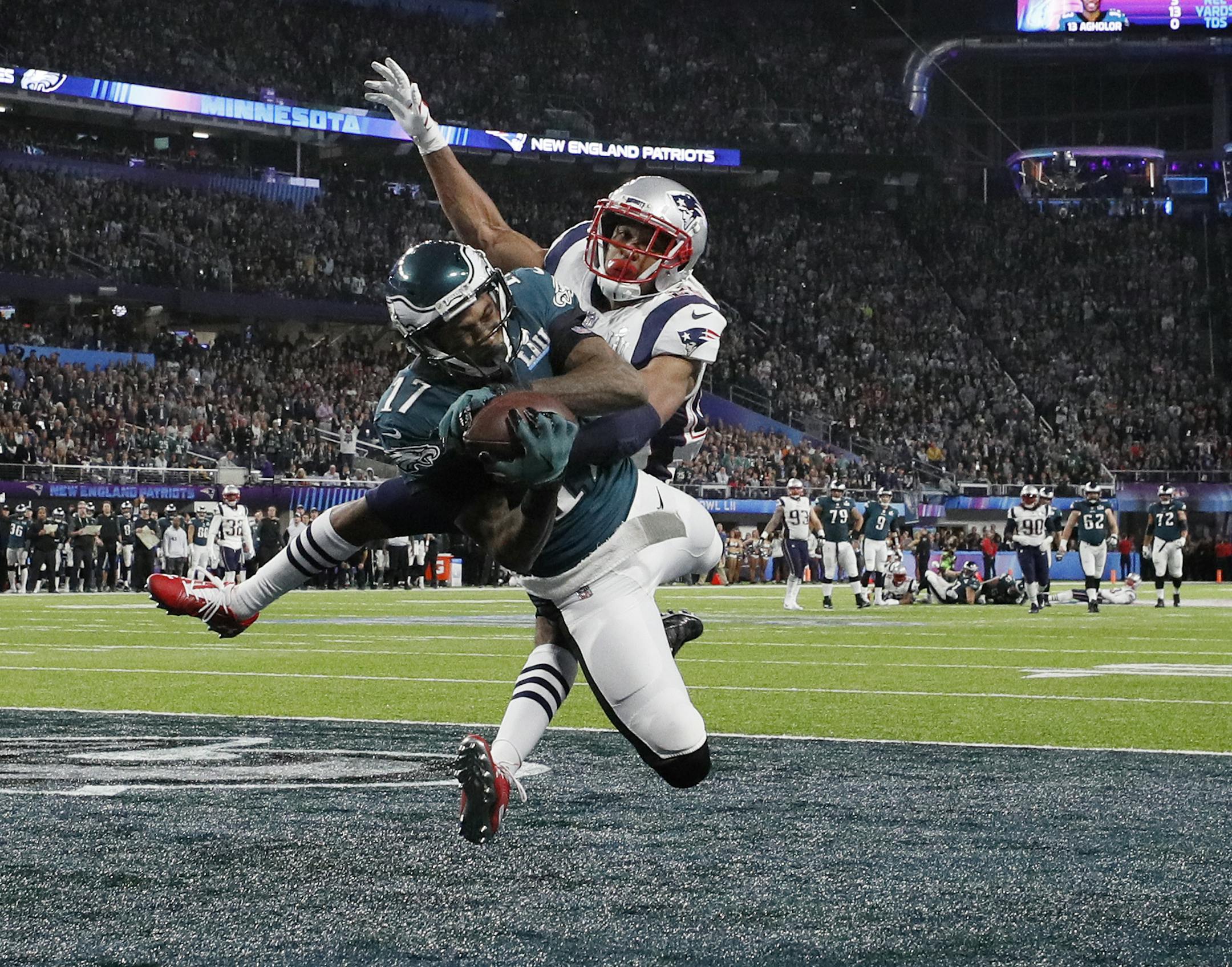 Philadelphia Eagles receiver Alshon Jeffery hauled in a 34-yard touchdown pass from quarterback Nick Foles in Super Bowl LII as Eric Rowe f the New England Patriots defended. The score gave the Eagles a 9-3 lead after the extra point was missed. ] Carlos Gonzalez &#xef; Carlos. Gonzalez@startribune.com The New England Patriots met the Philadelphia Eagles in Super Bowl LII Sunday evening, February 4, 2017 at U.S. Bank Stadium in Minneapolis.