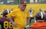 Jerry Kill, talking with one of his players during preseason practice, knows he can't control everything a player does. ''I spend more time teaching t