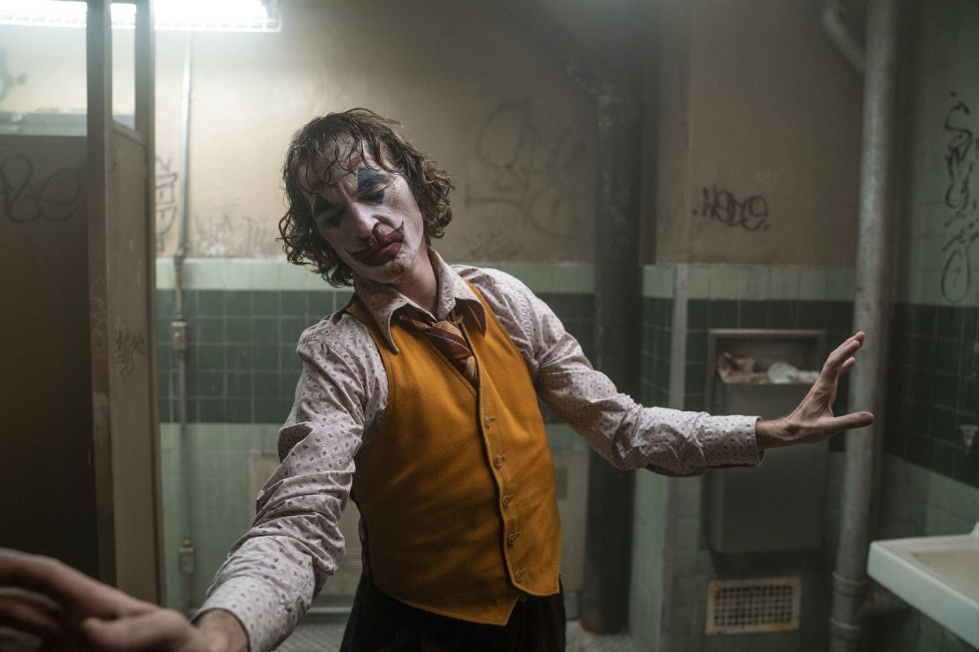 This image released by Warner Bros. Pictures shows Joaquin Phoenix in a scene from the film, "Joker." (Niko Tavernise/Warner Bros. Pictures via AP)