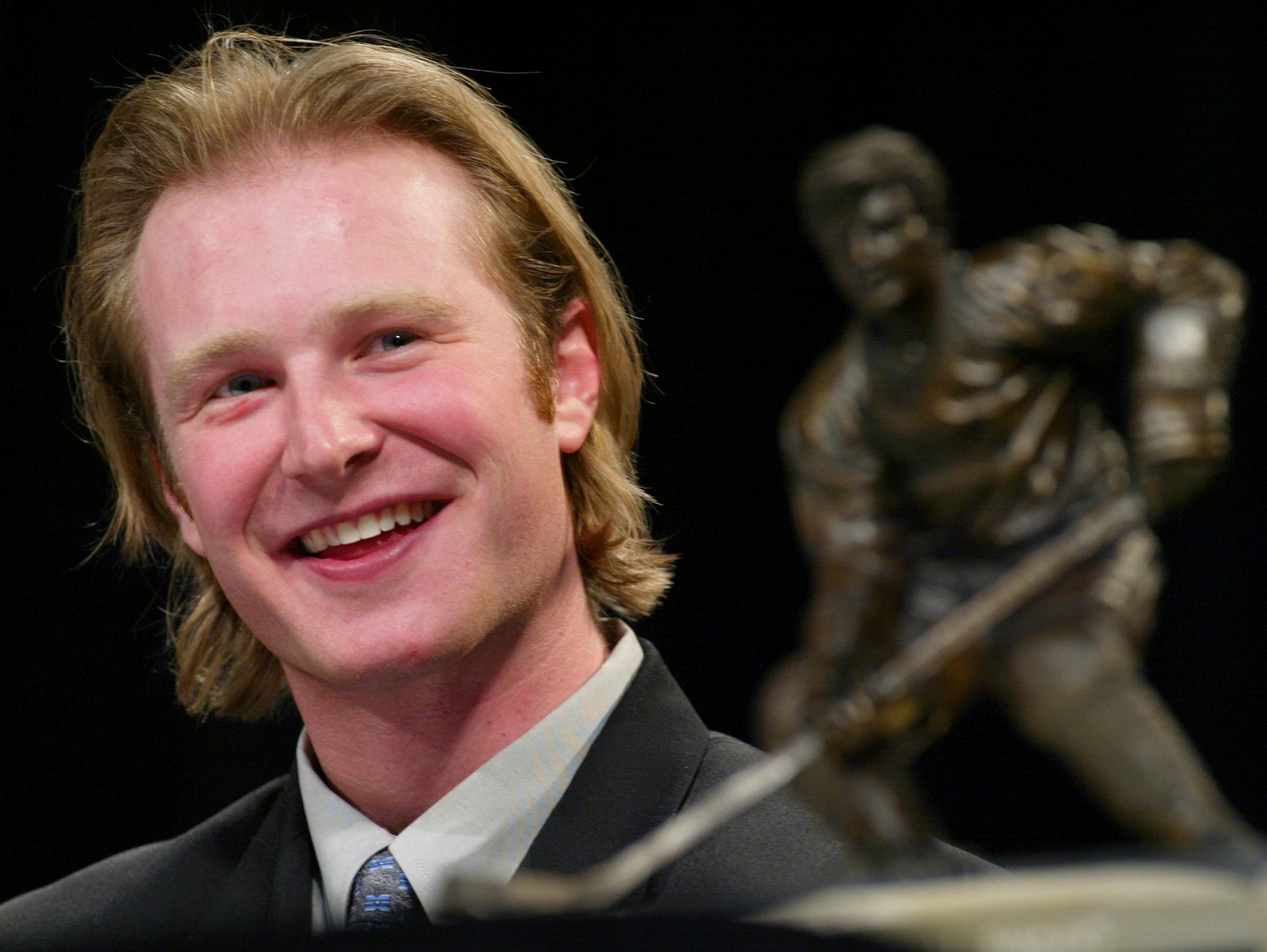 ST. PAUL - 4/5/02 - The Gophers' Jordan Leopold, a senior defenseman, won college hockey's most prestigious individual award, the Hobey Baker Memorial Award, at a Friday banquet in the RiverCentre Grand Ballroom in St. Paul.
IN THIS PHOTO: Jordan Leopold listening to his coach, Don Lucia, sing his praises after he was given college hockey's top honor Friday afternoon.