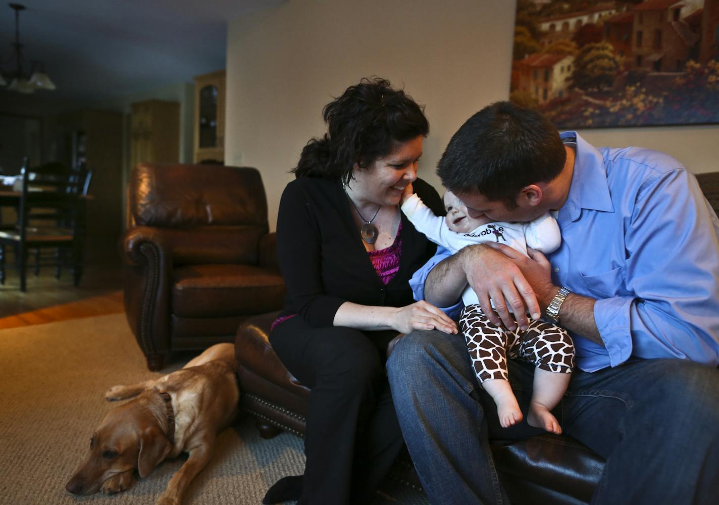 Andrea and Cory Pedersen held their daughter Anna at home on Thursday, March 7, 2013, in Rochester, Minn. Last year, when she was pregnant, Andrea Pedersen was invited to take part in an experiment at the Mayo Clinic, where she works. She took home a fetal monitor to listen to the baby's heartbeat at home, and did one prenatal visit by Skype. ] (RENEE JONES SCHNEIDER * reneejones@startribune.com)