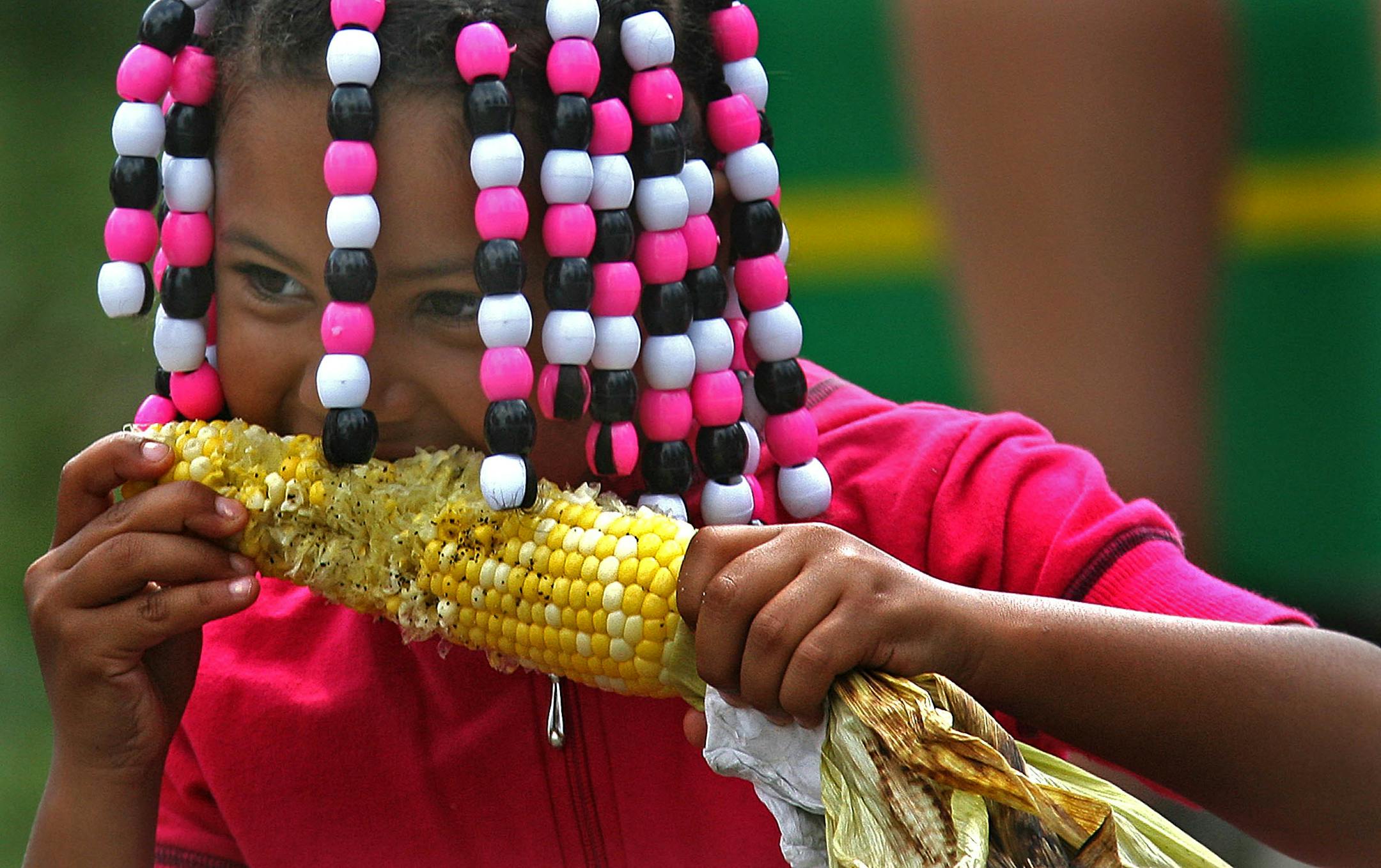 Despite having to work around a loose tooth, five-year-old Jonessa Jones of Albertville enjoyed one of the State Fair's traditional treats.