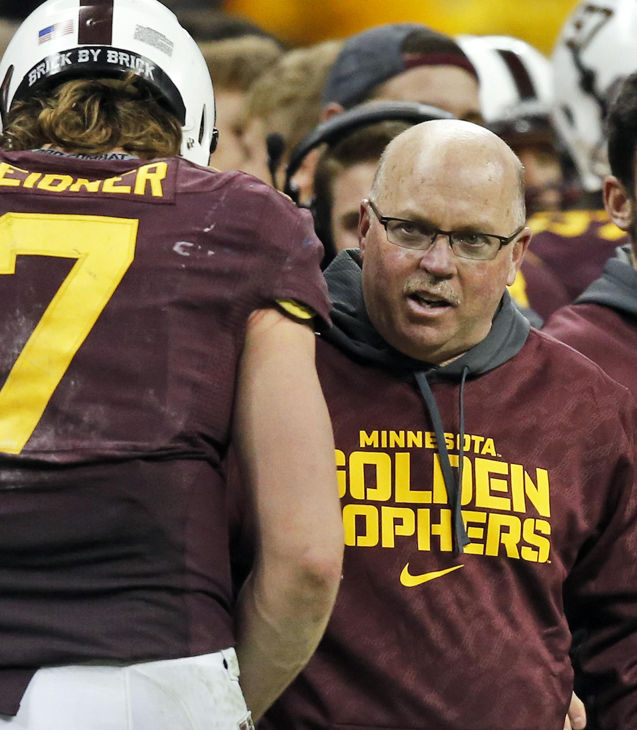 Minnesota Gophers vs. Syracuse Orange in Texas Bowl. Syracuse won 21-17. Gophers coach Jerry Kill talked with Gophers quarterback Mitch Leidner on the sidelines. (MARLIN LEVISON/STARTRIBUNE(mlevison@startribune.com)