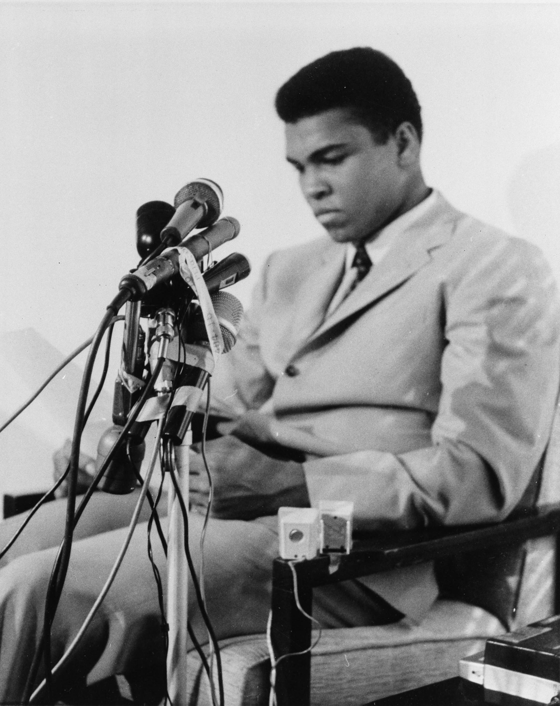 Muhammad Ali is seen at a news conference in Louisville, Kentucky, April 20, 1967, to say he will not accept miltary service of any nature when he is called for induction In Houston on April 28. He said "I ain't got no quarrel with them Viet Cong," and that the real enemy of his people "is right here" and not in Vietnam or anywhere else.