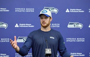 Seattle Seahawks quarterback Sam Darnold talks to the news media after practice Wednesday.