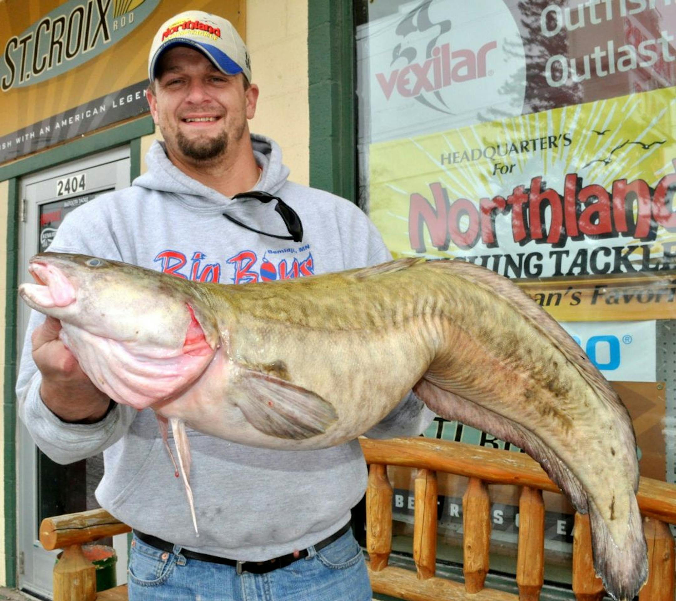 Aaron Guthrie of Bemidji shows off his 19.5-pound burbot he caught Friday on Lake of the Woods.. If certified by the DNR, it will be a new state record burbot.