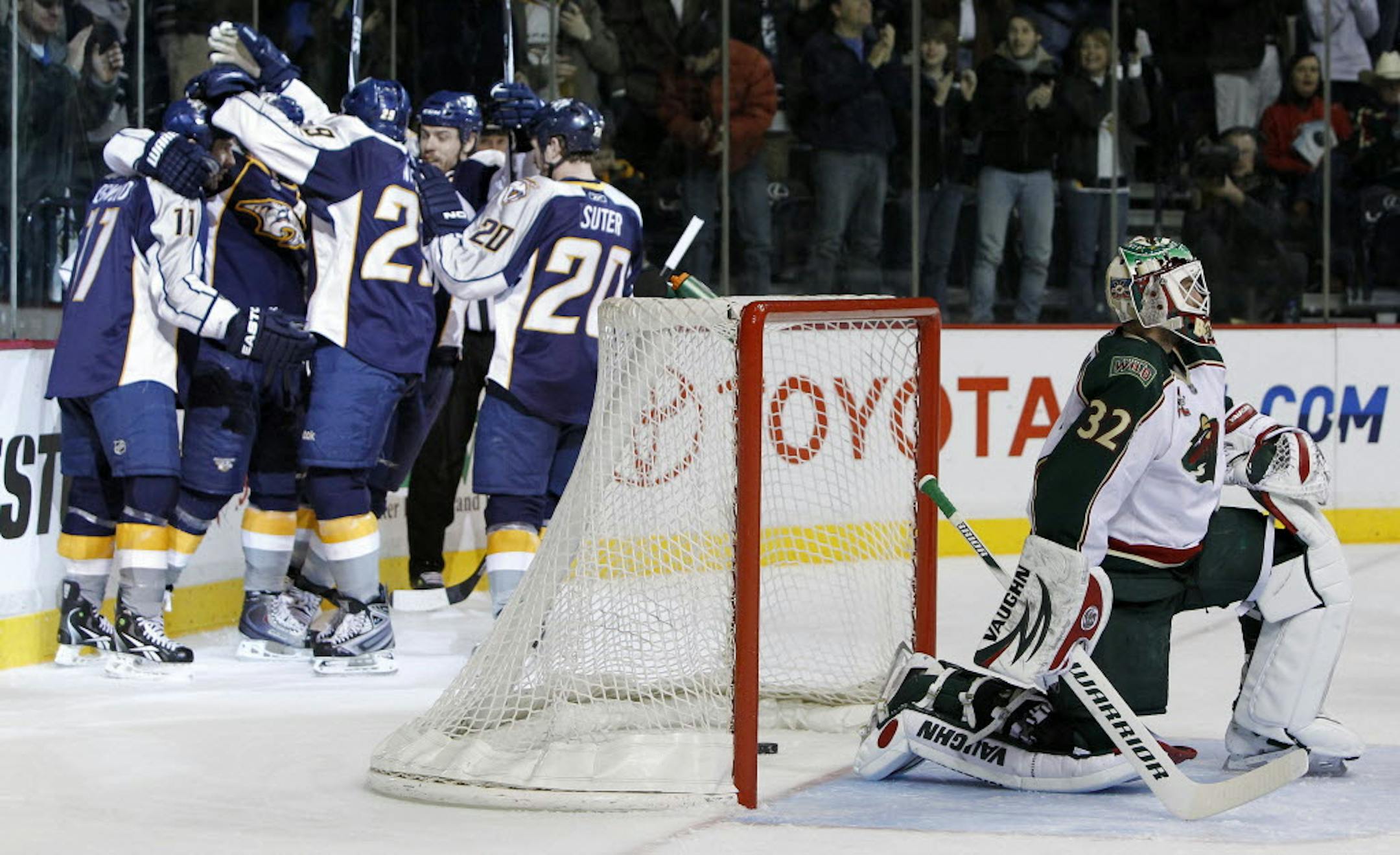 Wild goalie Niklas Backstrom got up as Predators players celebrated a goal by Martin Erat on Thursday.