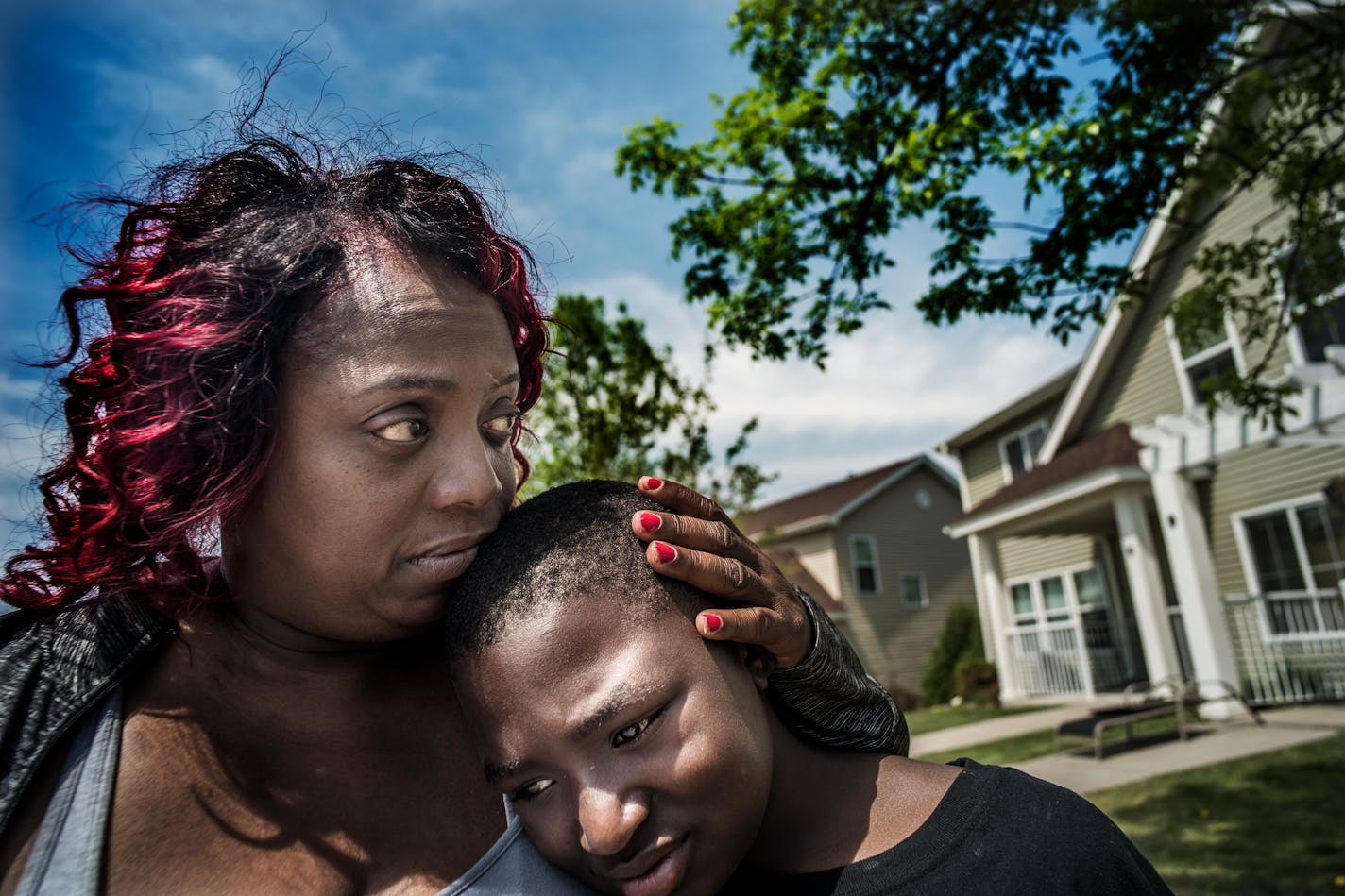 Melissa Coleman, Samuels' grandmother hugged grandson Kemarion Prowell,11, who was outside when 7-year-old Keyaris Samuels shot himself last nite. Samuels was home alone n his Plymouth home when a loaded handgun was discovered in a box with a toy and he accidentally shot himself with it, police said Thursday.
]Richard Tsong-Taatarii�rtsong-taatarii@startribune.com