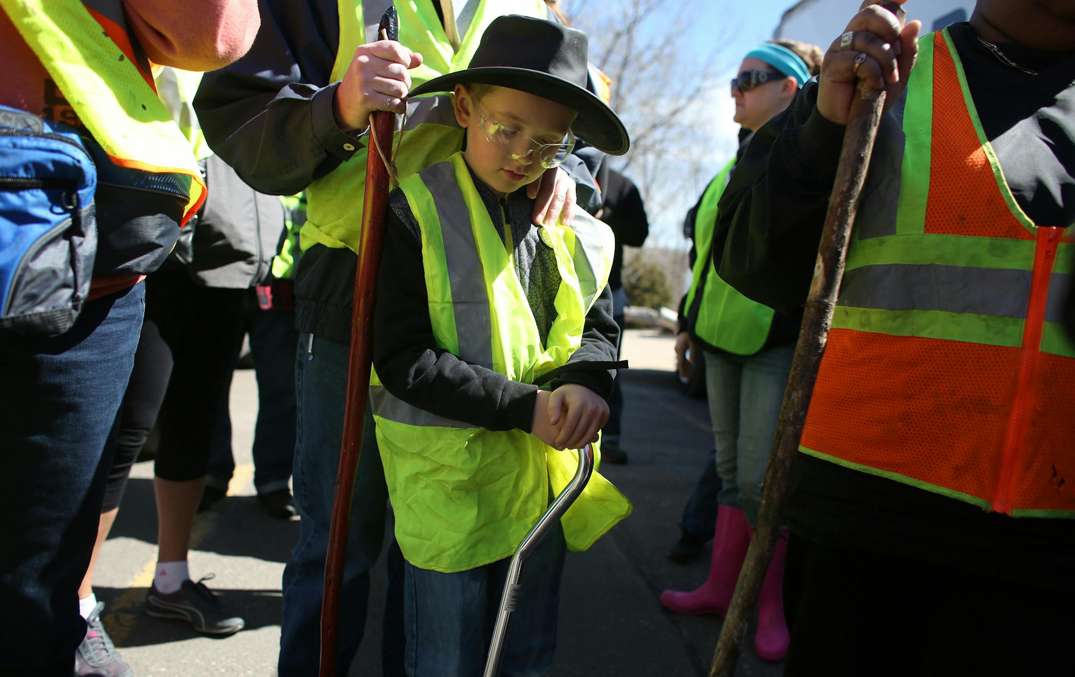 Jacob Poore, 9, of Hanover, waited with his father Virgil as they prepared to search for Barway Collins. ] (KYNDELL HARKNESS/STAR TRIBUNE) kyndell.harkness@startribune.com Citizen-organized search for missing Crystal 10-year-old, Barway Collins at North Mississippi Regional Park in Minneapolis Min., Thursday, April 2, 2014.