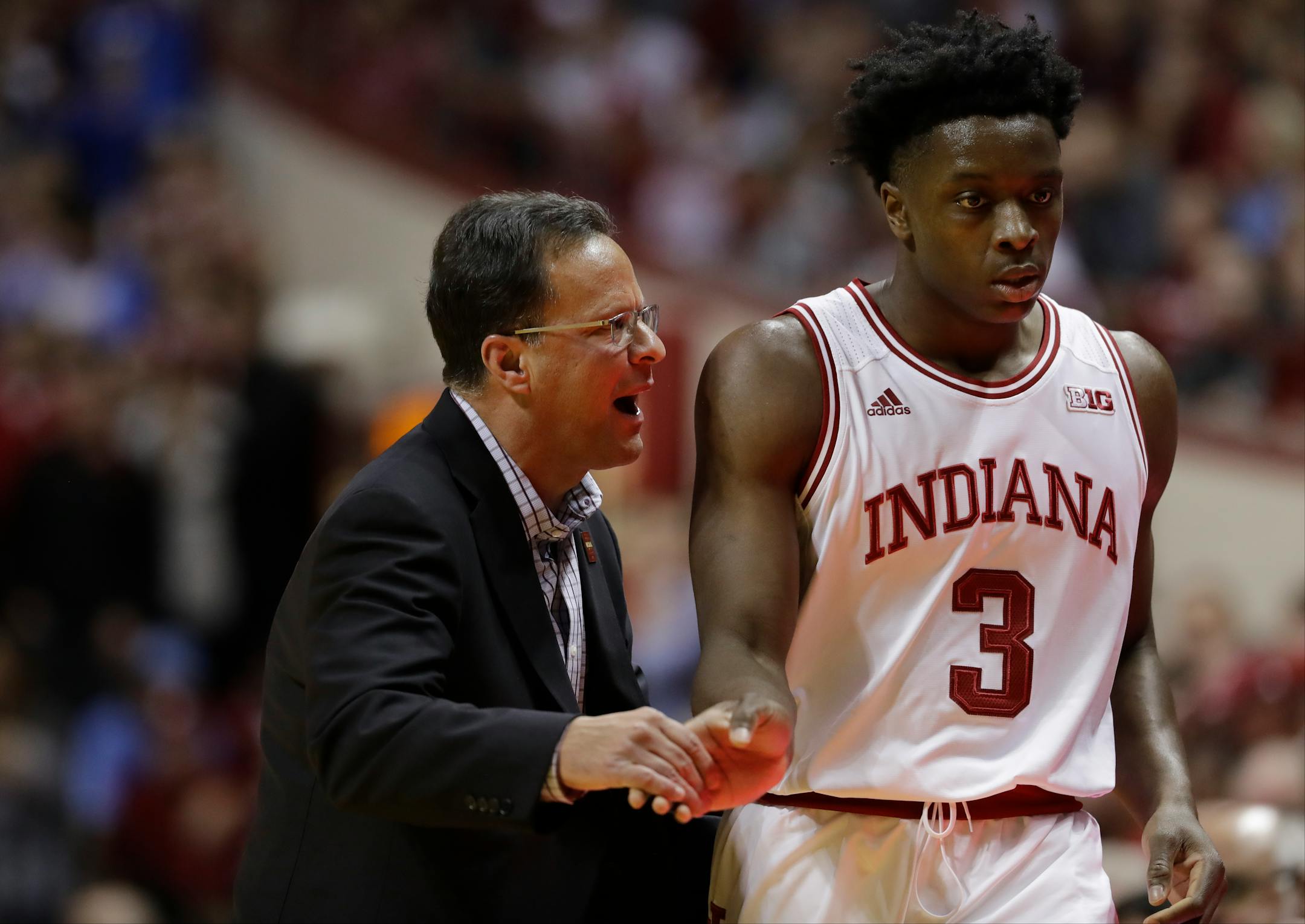 Indiana head coach Tom Crean talks with OG Anunoby (3) during the first half of an NCAA college basketball game against North Carolina, Wednesday, Nov. 30, 2016, in Bloomington