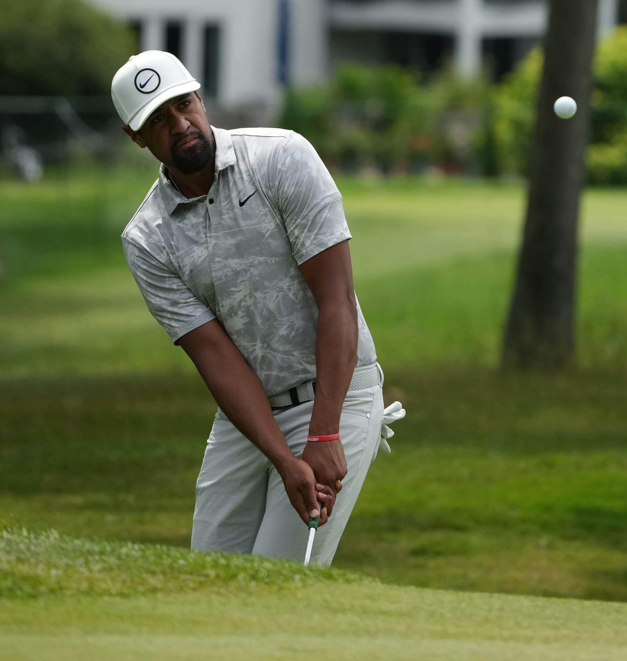 Tony Finau hits out of the rough on the 6th hole Sunday at TPC Twin Cities.