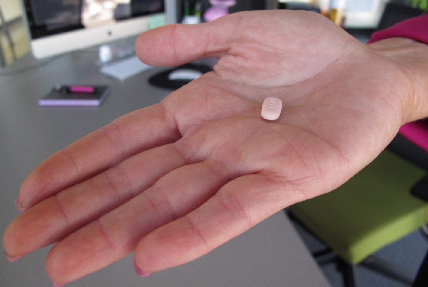 In this Friday, Sept. 27, 2013, photo, Cindy Whitehead holds a tablet of flibanserin in her office at Sprout Pharmaceuticals in Raleigh, N.C. Sprout Pharmaceuticals said Wednesday, Dec. 11, 2013, it has reached an impasse with the Food and Drug Administration over its drug, flibanserin. The daily pill is designed to increase libido in women by acting on brain chemicals linked to mood and appetite. (AP Photo/Allen G. Breed) ORG XMIT: RPAB105