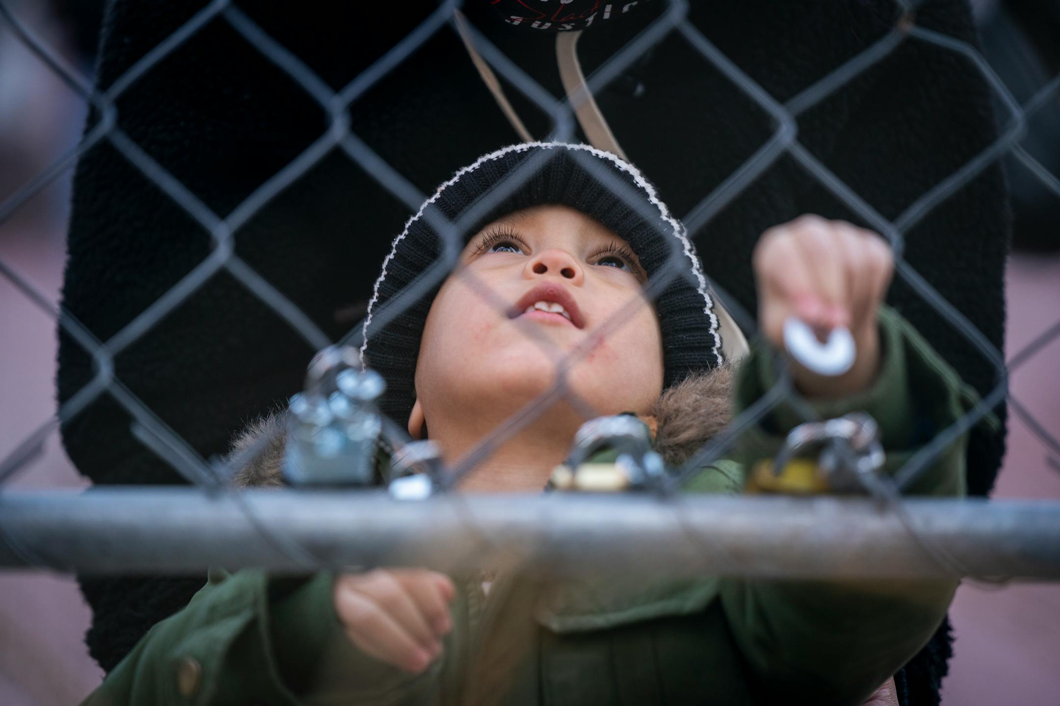 Cayden Totushek, 3, of Buffalo placed a lock on the fence outside the Hennepin County Government Center during the Locks for Loved Ones Lost: Part II event.