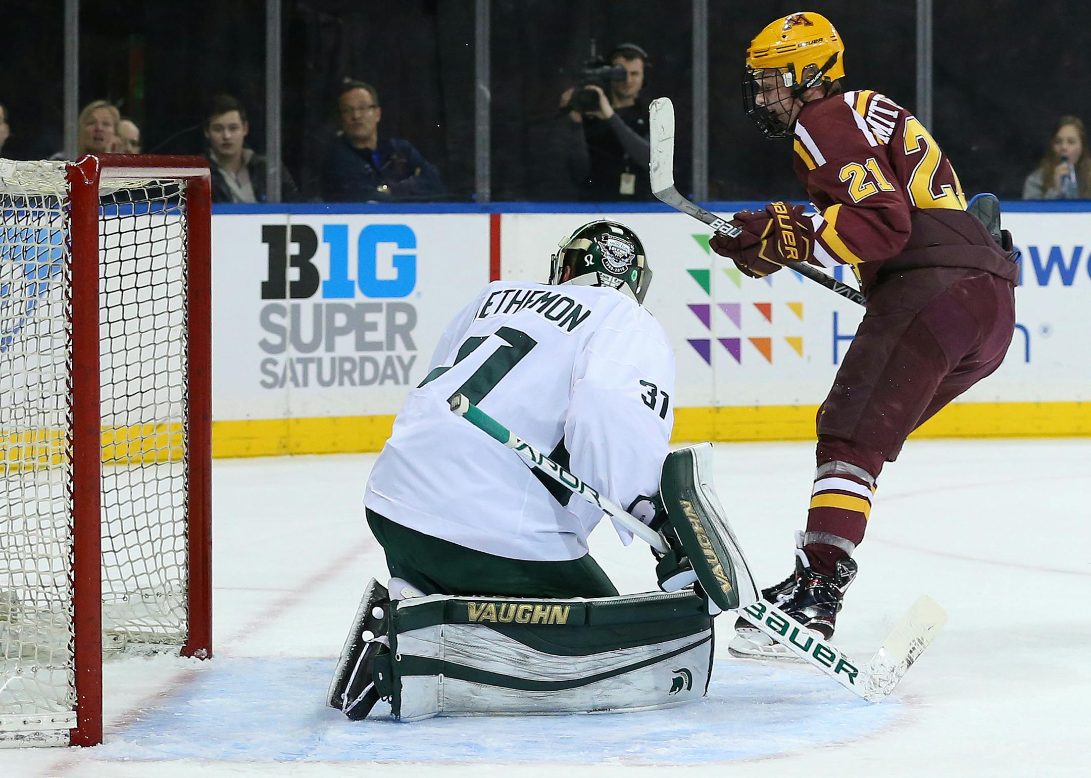 SPECIAL TO MINNEAPOLIS STAR TRIBUNE -- Minnesota Golden Gophers forward Casey Mittelstadt (21) scores past Michigan State Spartans goalie John Lethemon (31) during the first period of a hockey game at Madison Square Garden. Saturday, Jan. 20, 2018, in New York. (AP Photo/Rich Schultz) ORG XMIT: NYRS207