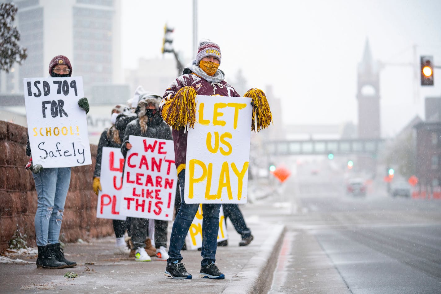 State officials have recently clarified guidance about COVID-19 restrictions for schools. In this photo, taken Oct. 20, a group of parents and students in Duluth protested for the school board to allow extra-curricular activities and sports to not be cancelled due to rising case numbers.