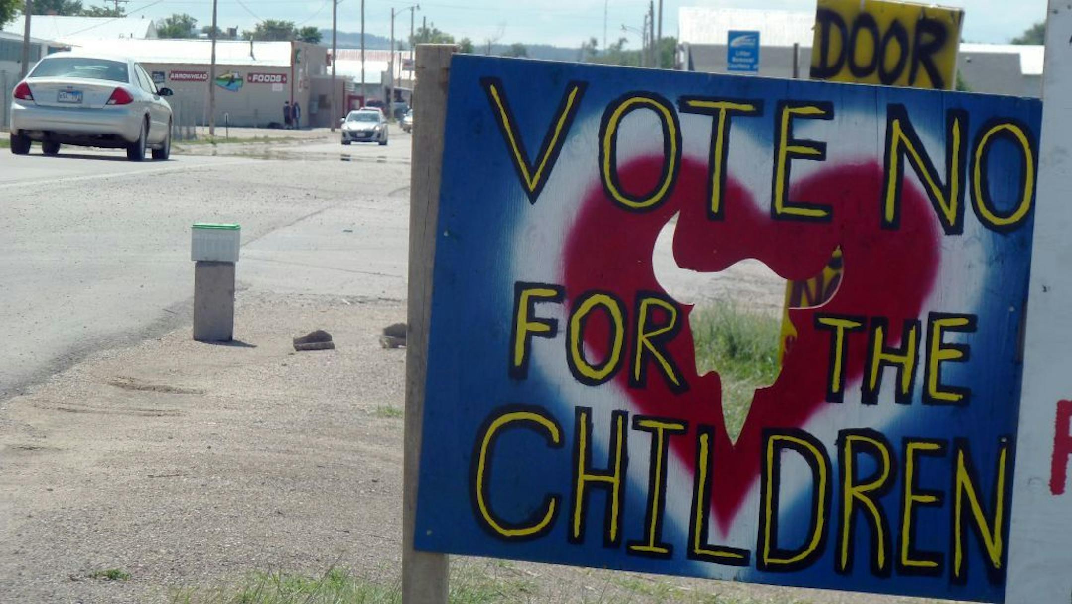 In this Aug. 8, 2013, photo is a sign outside Whiteclay, Neb., urging Pine Ridge Indian Reservation residents to oppose the legalization of alcohol sales.