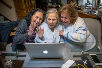 Juanita Moran's daughters Becky Cusick, left, and Marie Zellner, right, joined her for a zoom call for a rosary prayer shortly after being cleared of 